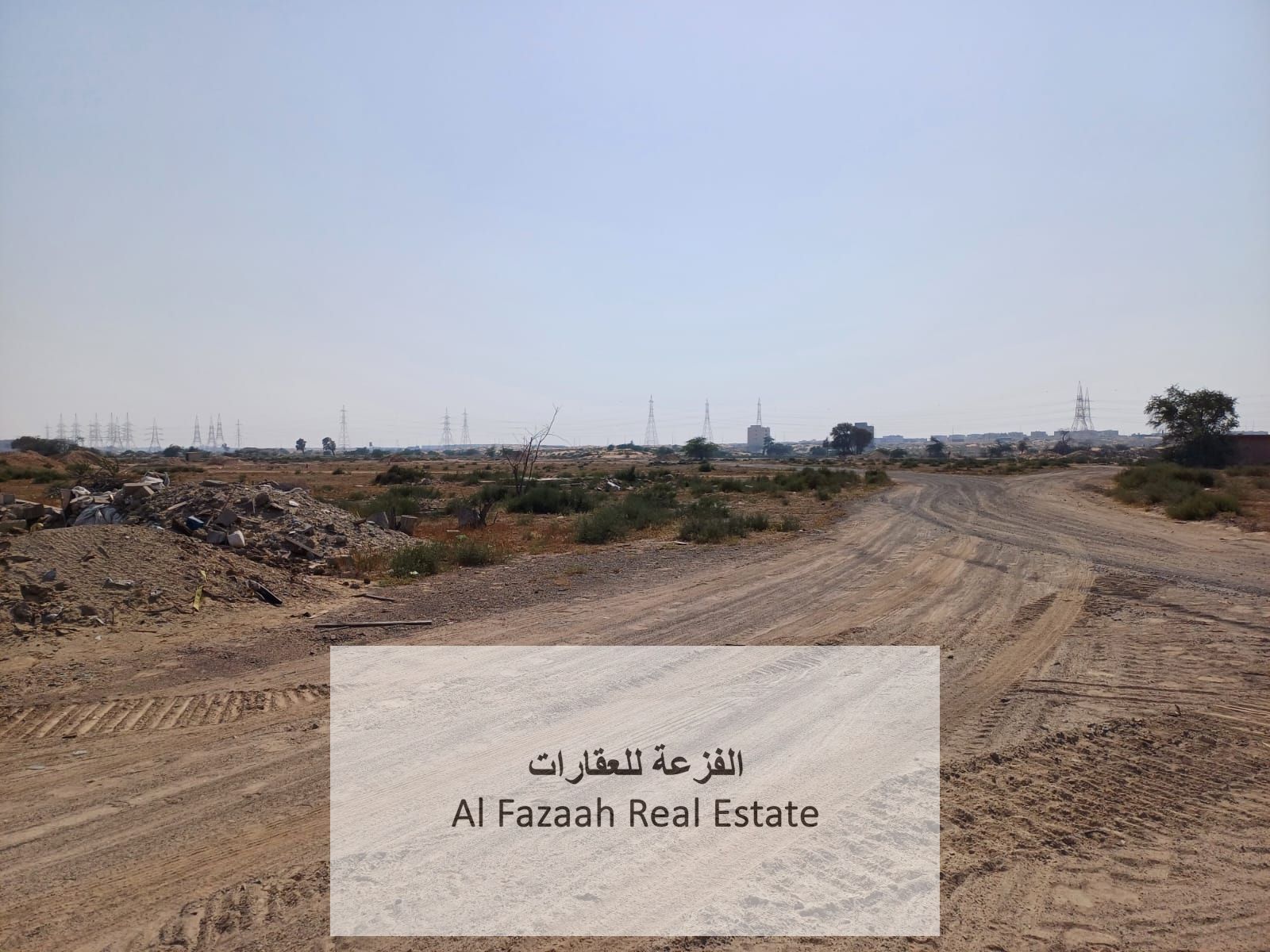 For sale in Sharjah, Al Qasimia City 4, corner plot on Street 152, commercial permit for showrooms, offices, workers' accommodation, and industrial us