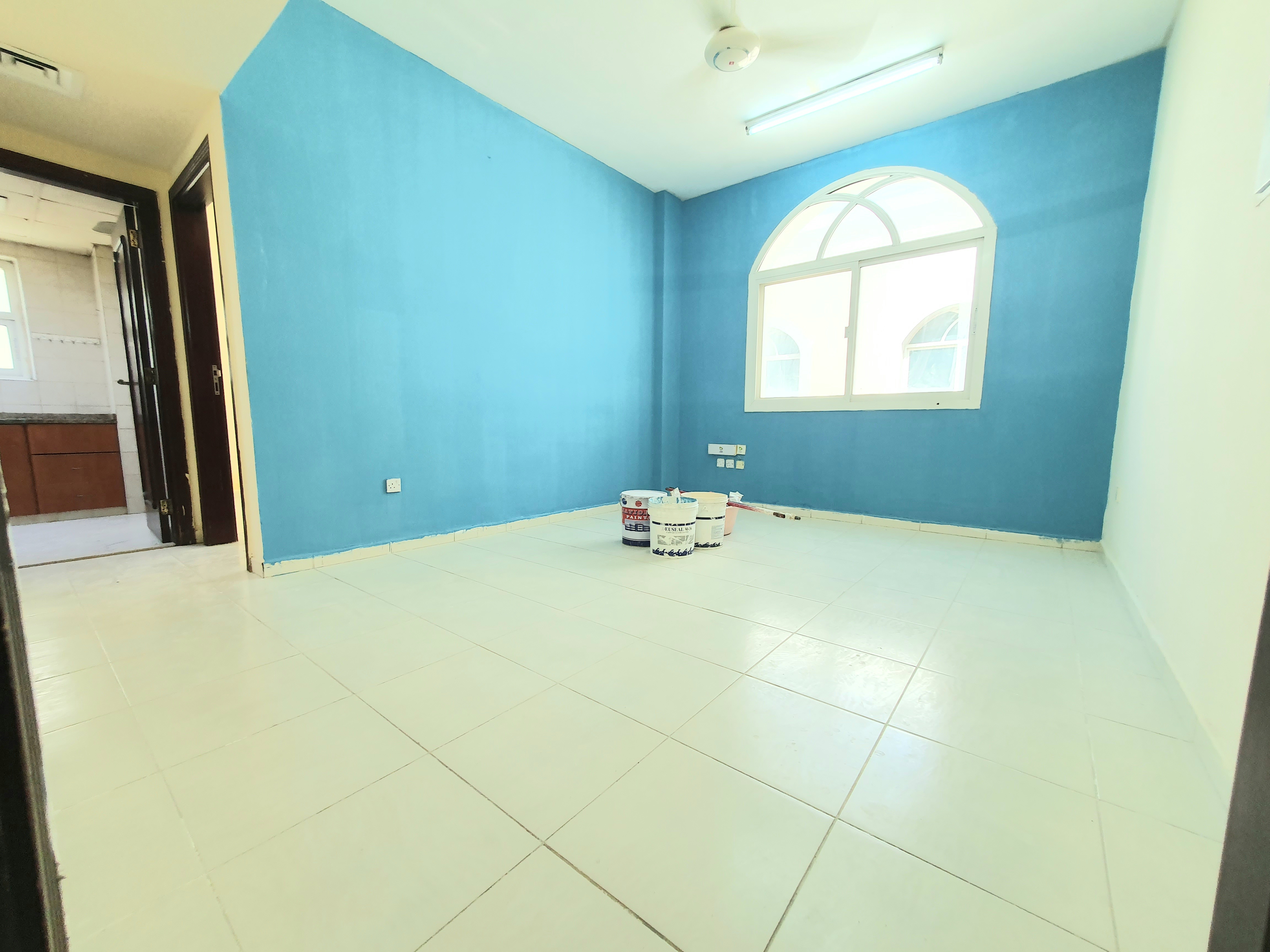LAVISH 1BHK WITH CENTRAL AC ON ROAD BUILDING IN MUWAILEH