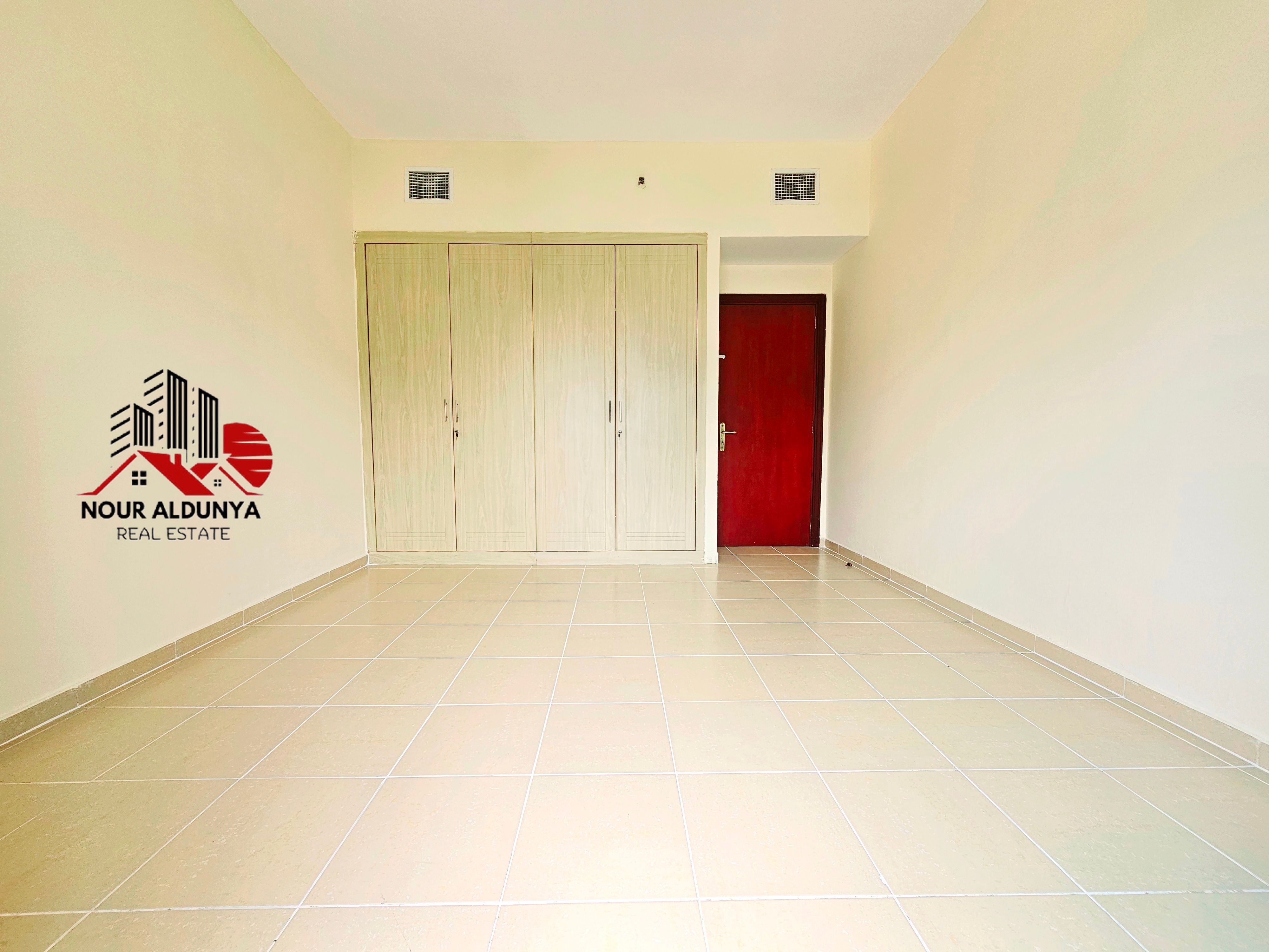 ( MONTHLY PAYMENTS )12 CHEQUES - SPACIOUS 1BHK WITH BALCONY RENT 52K - FAMILY BUILDING - OPEN VIEW - CAR PARKING FREE- CLOSE TO NMC HOSPITAL