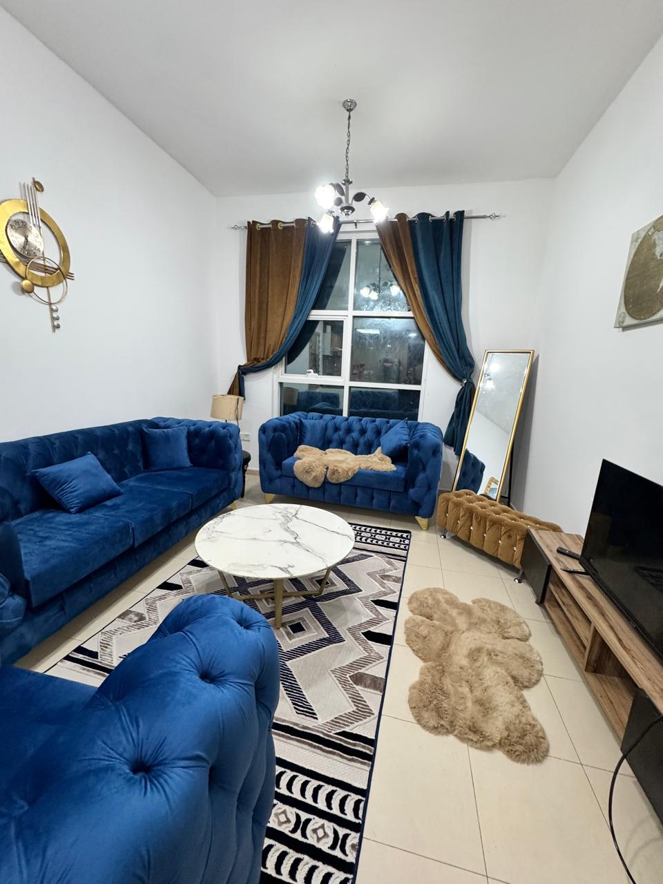 For rent in Ajman, a furnished apartment with one room and a living room, the first resident in the City Tower, a large area with a balcony and 2 bath