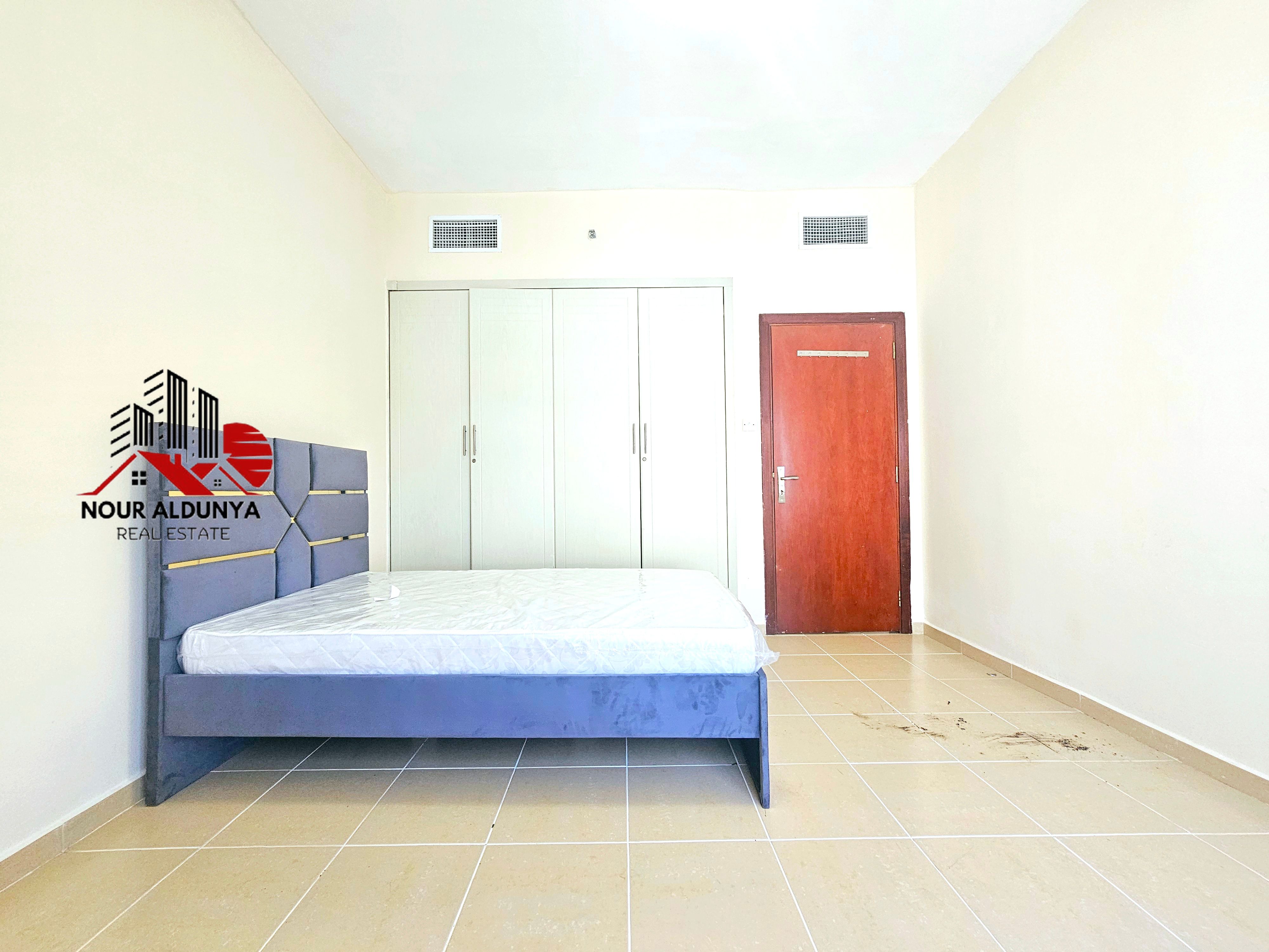 12 CHEQUES - CLOSE TO NMC - SPACIOUS 1BHK RENT 48K - FAMILY BUILDING - CAR PARKING FREE