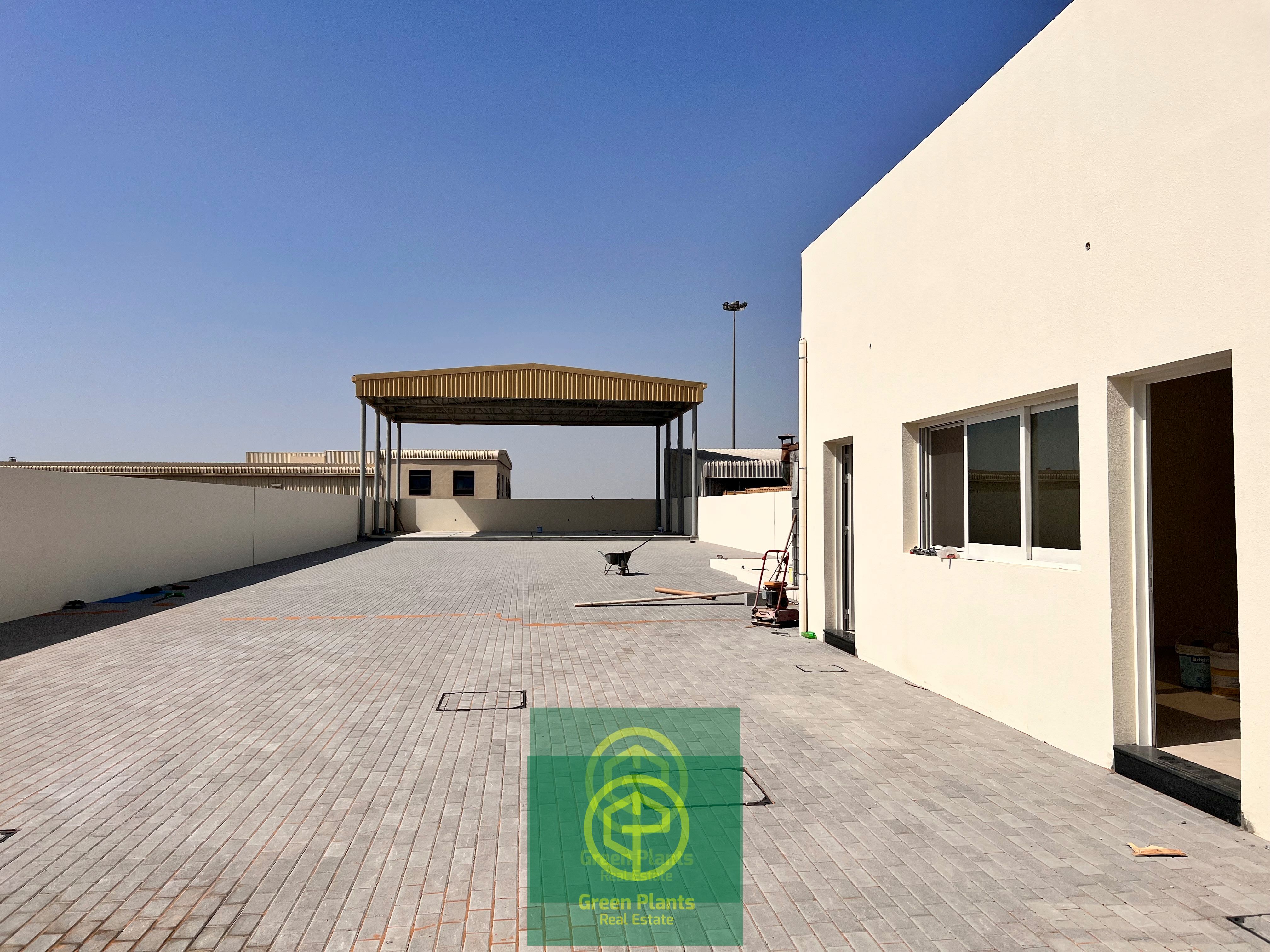Al Warsan 11,000 sq. Ft open yard with built-in open shed, offices, and toilet