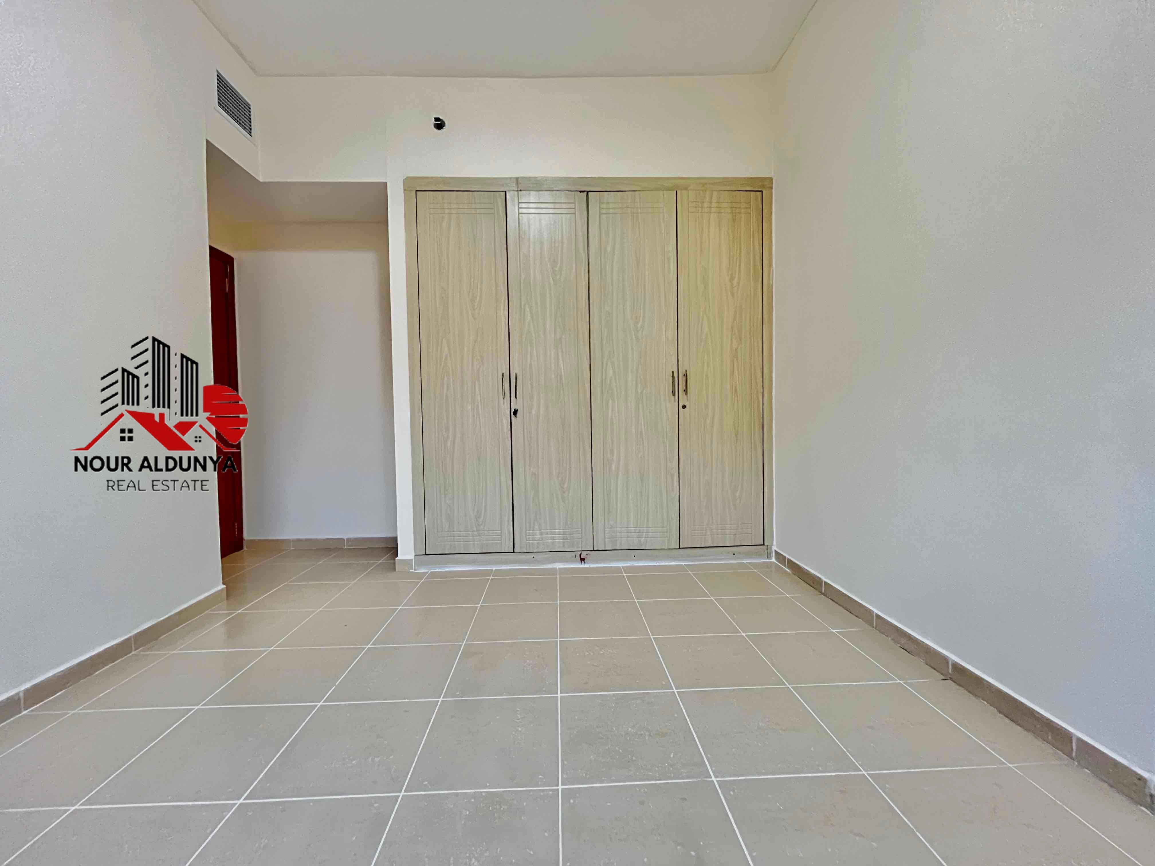 12 CHEQUES - SPACIOUS 1BHK WITH BALCONY RENT 48K - FAMILY BUILDING - OPEN VIEW - CAR PARKING FREE- CLOSE TO NMC HOSPITAL