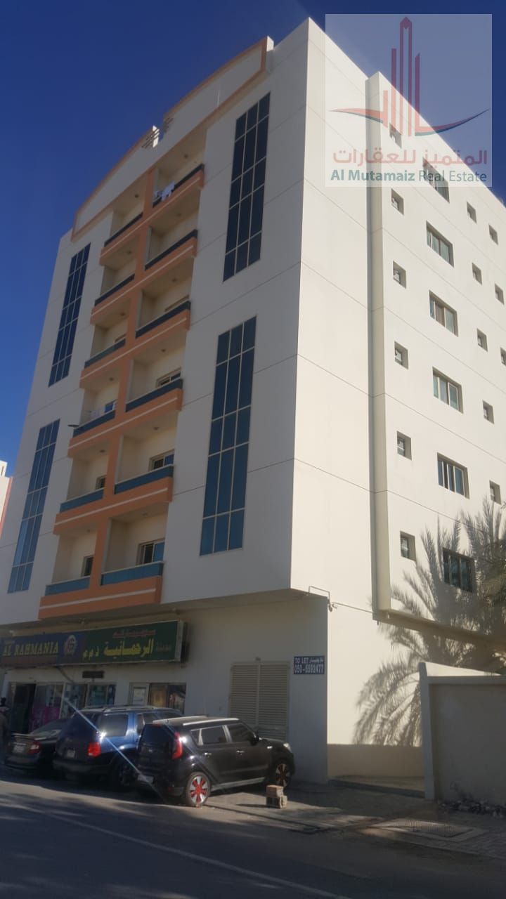 A room and a living room with a balcony in Rashidiya 2, close to Falcon Towers, for 25 thousand annually.