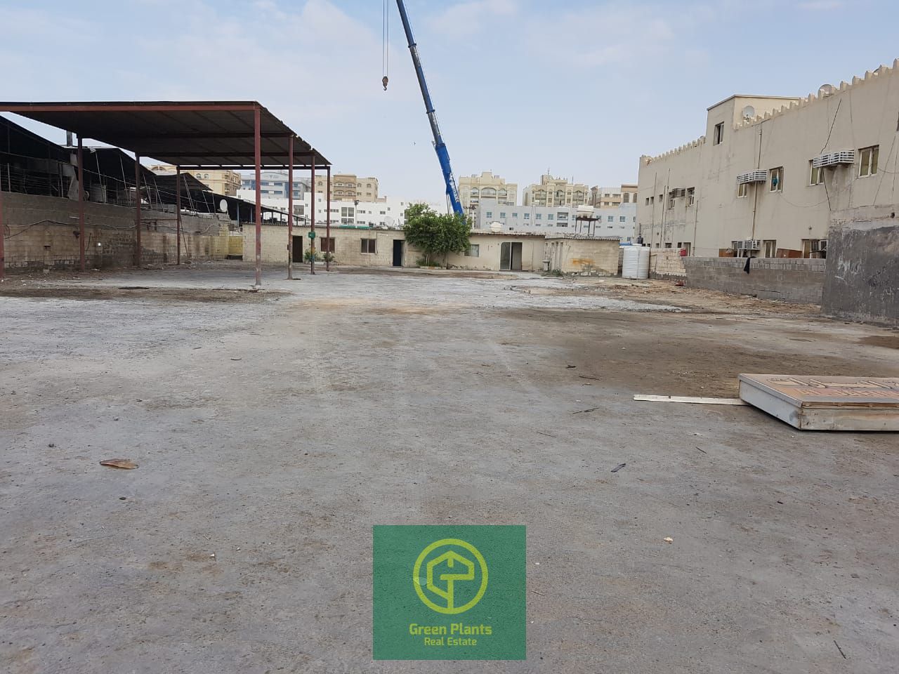 Al Sajaa 21,000 sq. Ft open land with built-in toilet and office