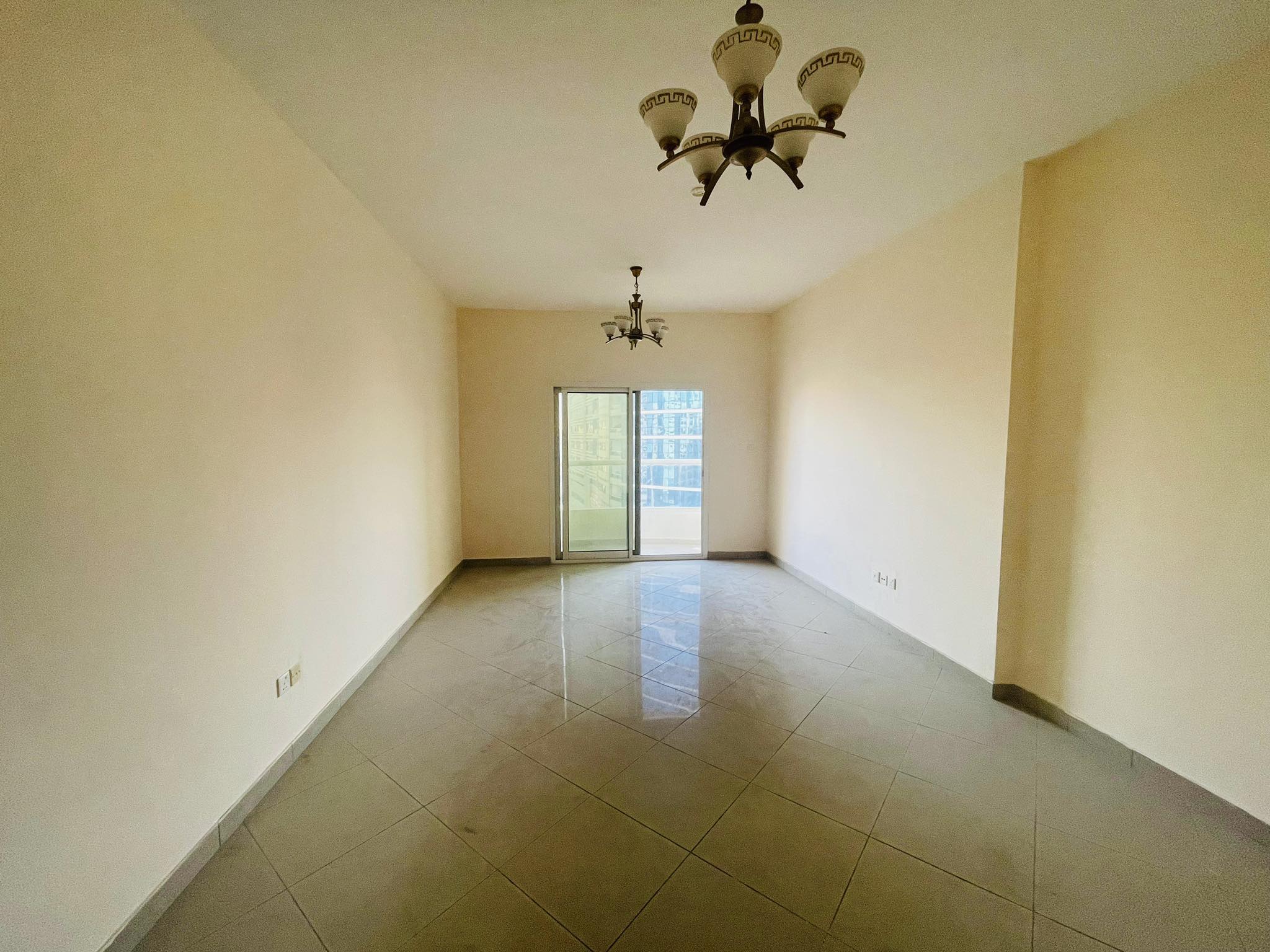 SPACIOUS 2 B/R HALL AVAILABLE FOR RENT WITH MAID'S ROOM, BALCONY,3 BATHROOMS IN AL NAHDA SHARJAH OPP SAHARA CENTER 47K