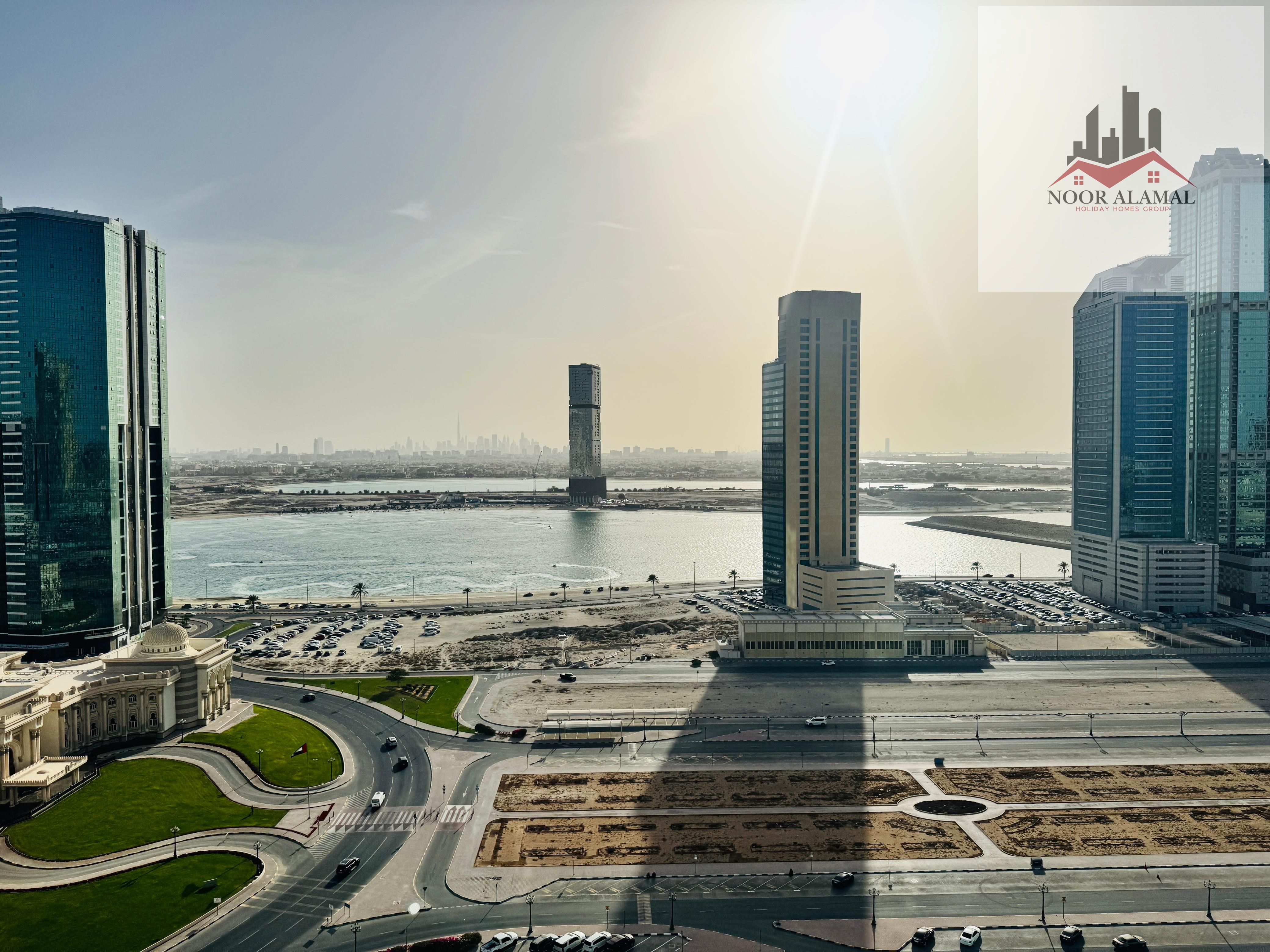 Sharjah Al Mamzar A room, a hall, a kitchen, two bathrooms, and a balcony overlooking Al Mamzar Lake. The price is 6000, including internet.