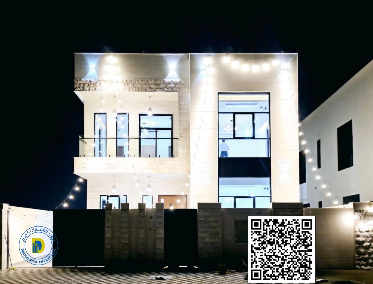 For sale in Al Helio 2, Ajman, a luxurious villa with a modern design. The price includes registration fees.