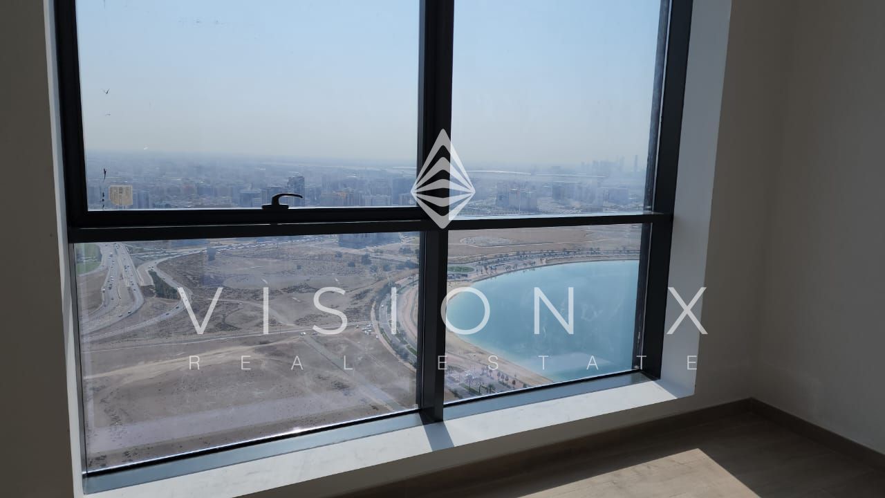 Waterfront Living: Modern 2-Bedroom in Al Mamzar’s Iconic Tower