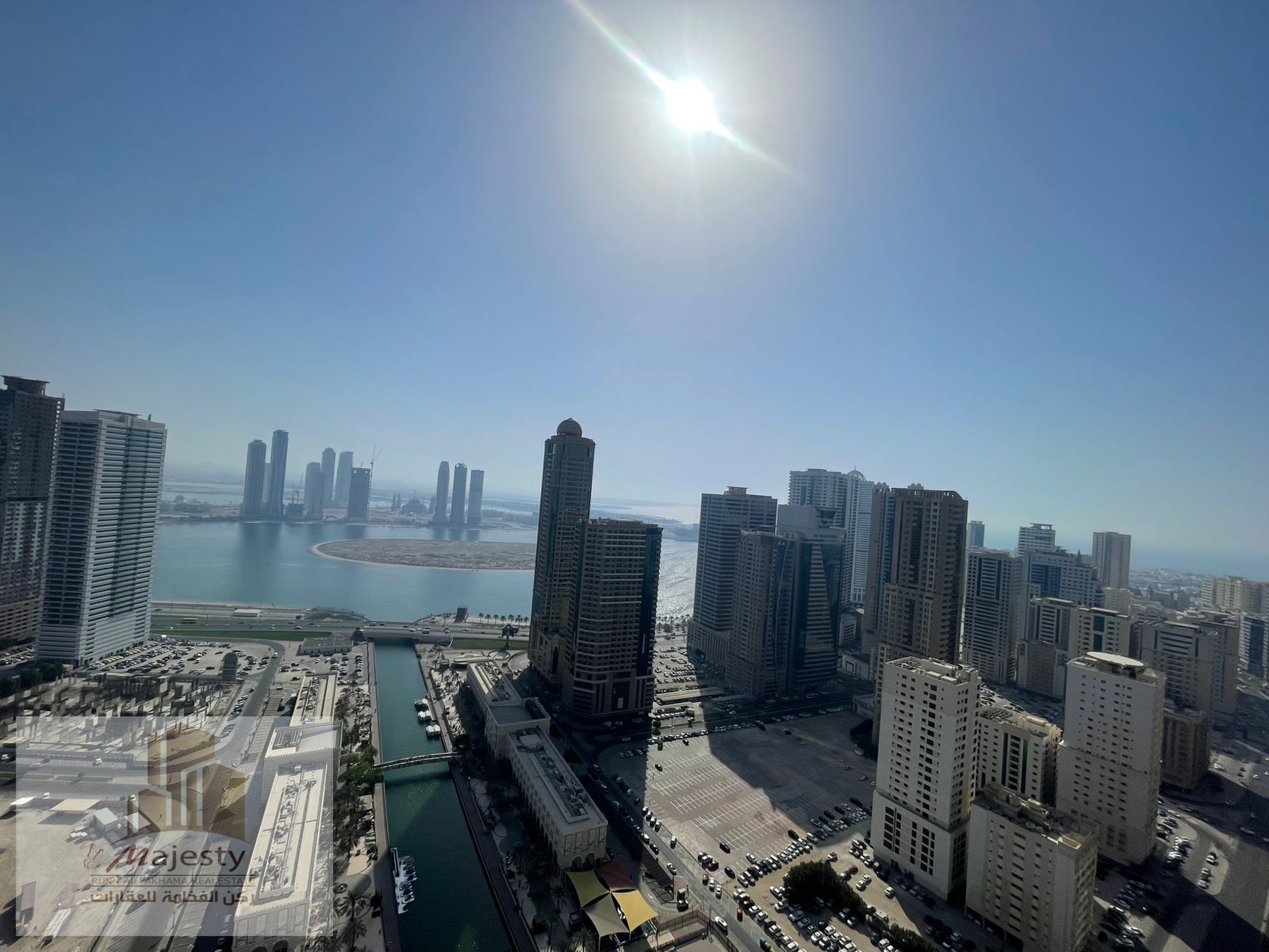 For lovers of distinctive views, an apartment for rent in a serviced tower with a gym and a swimming pool, featuring a panoramic view of Al Qasba Cana