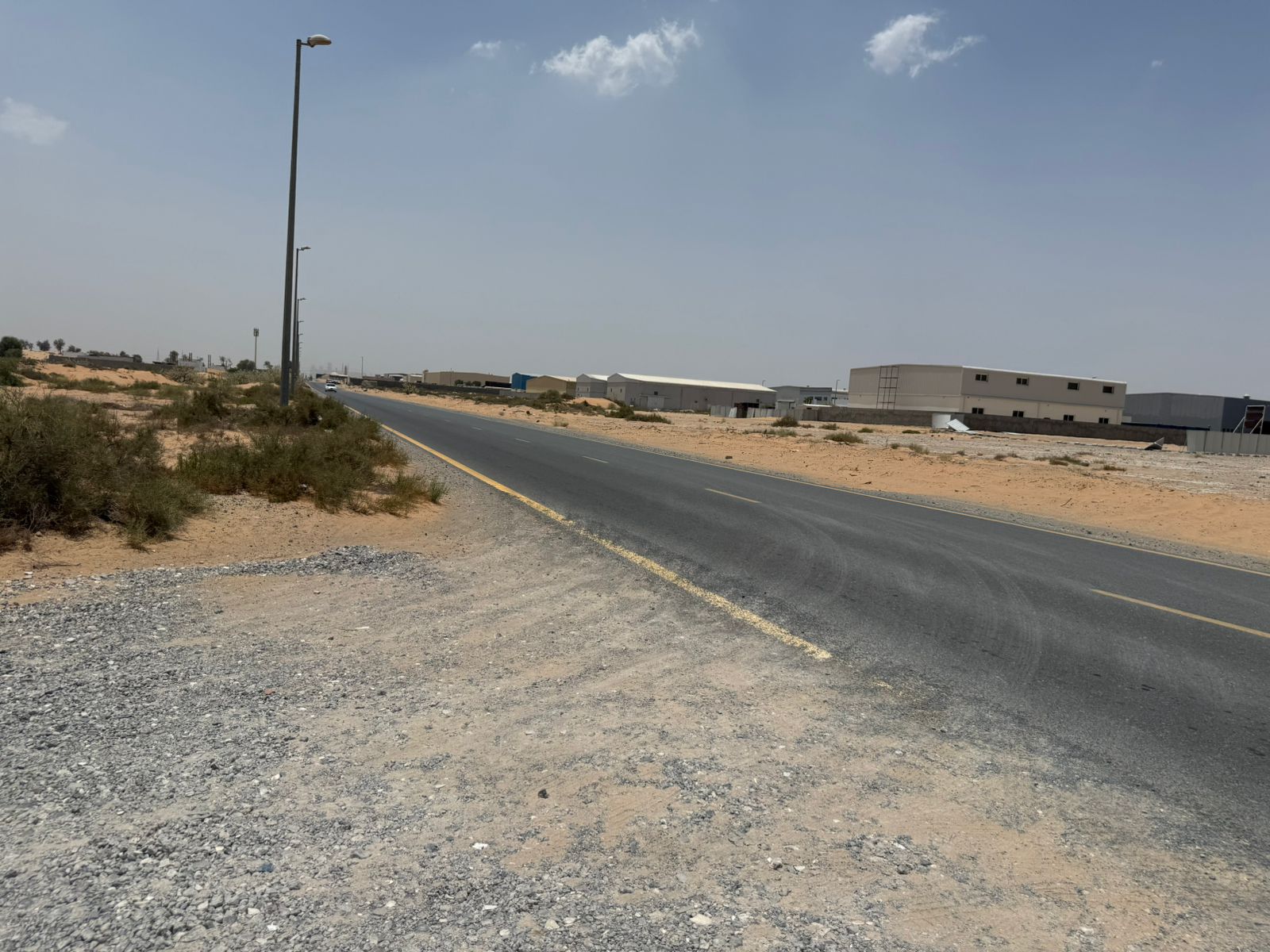 Commercial land for sale in Umm Al Quwain on a main street