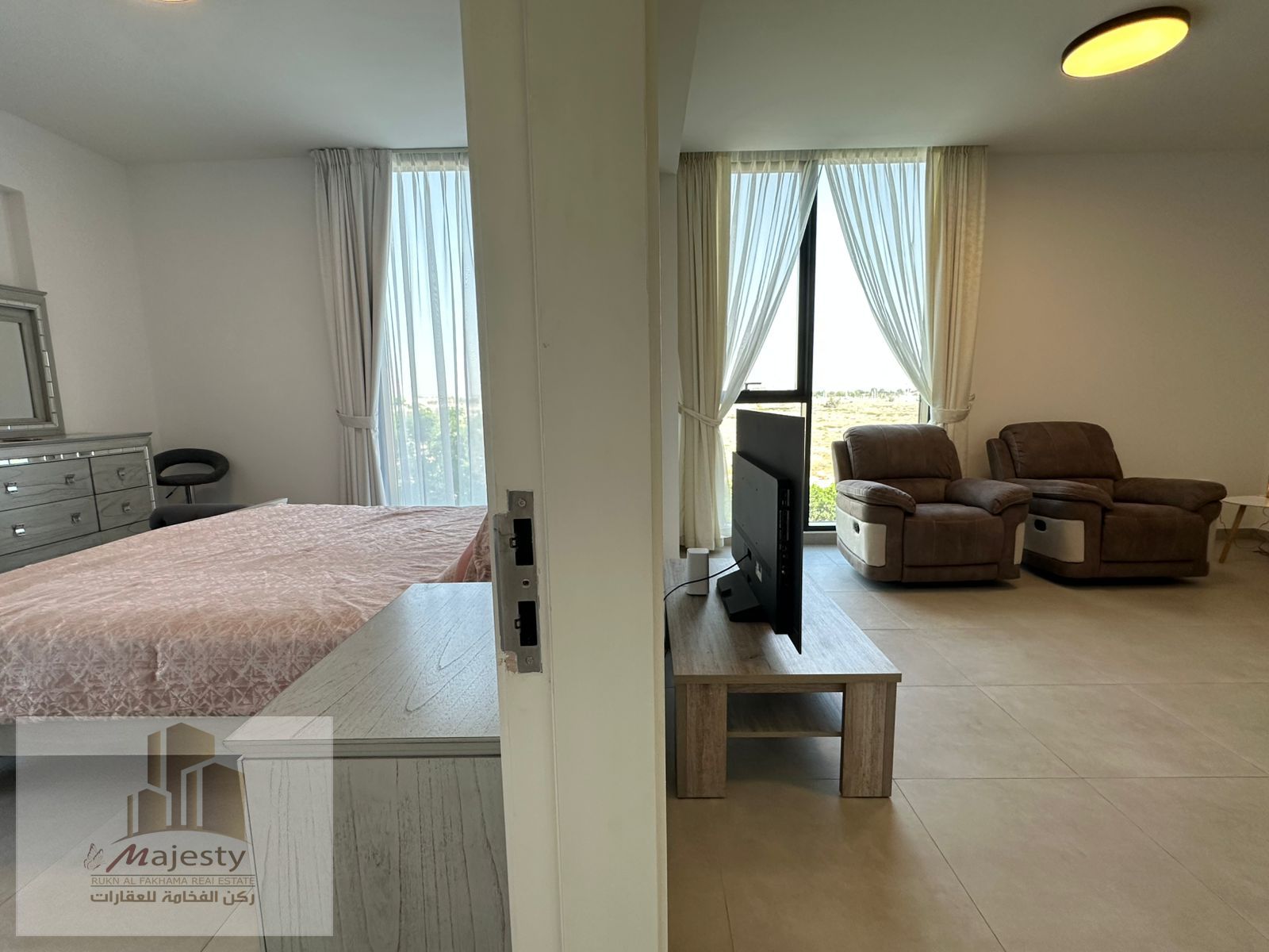 For sale, a two-bedroom apartment with a hall in Aljada / Sharjah Emirate.