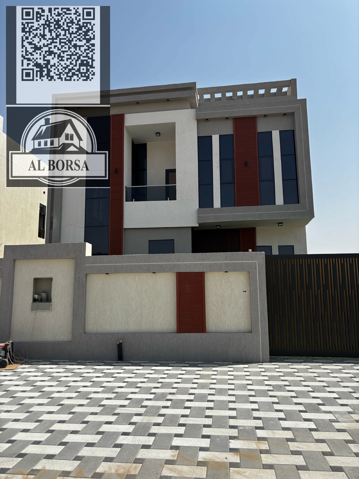 For sale, a villa in Al Helio 2, Ajman, consisting of 4 master bedrooms, a majlis, and a hall, including registration fees.