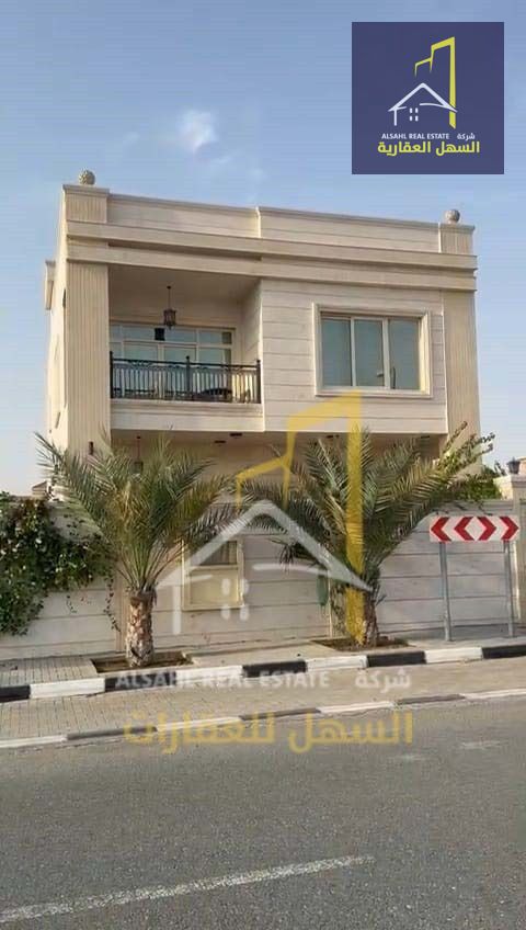 For sale, a luxurious villa in Sharjah - Al Hoshi area, with a stone facade and a prime location near Al Hoshi Bridge. The