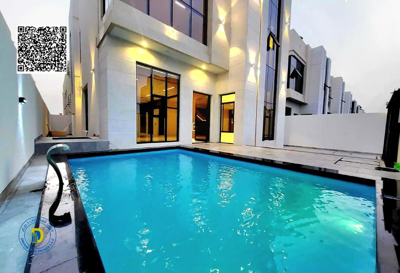 Enjoy the luxury of a luxurious 5BR villa with pool, including registration fees, Al Helio 2 , super deluxe finishing, bank financing, freehold