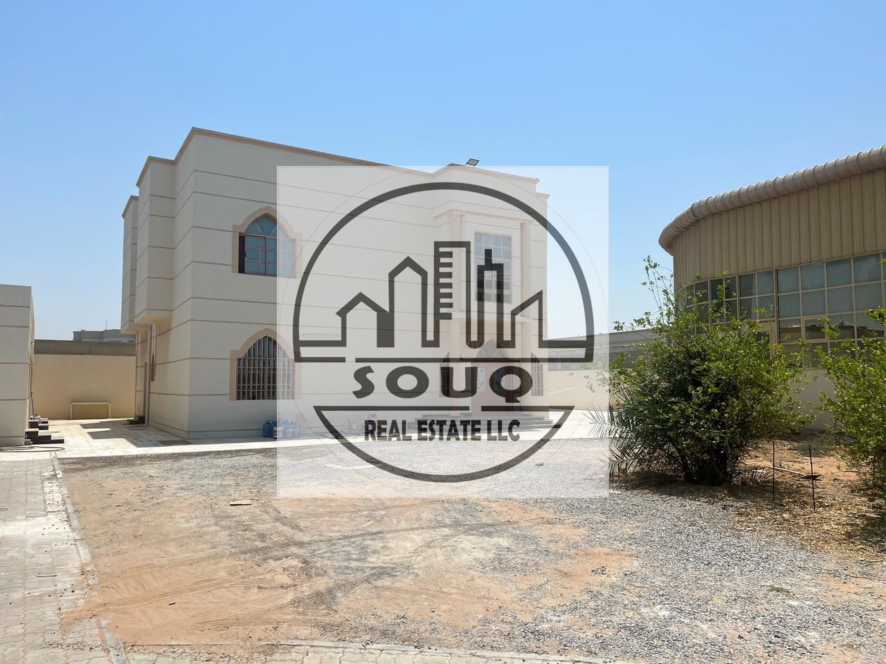 Spacious 6-bedroom villa with swimming pool and sitting area.