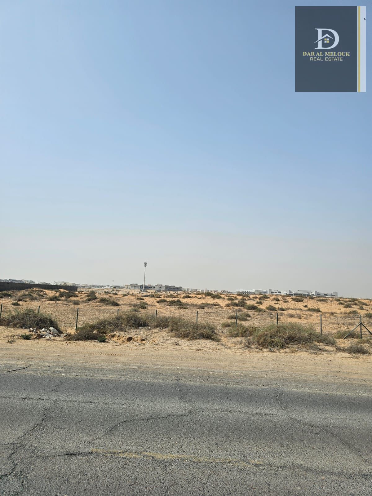 For sale in Sharjah Al Dabdaba North Commercial and residential plot, 2,985 sq ft Very prime location on the main 97-meter street separating Ajman and