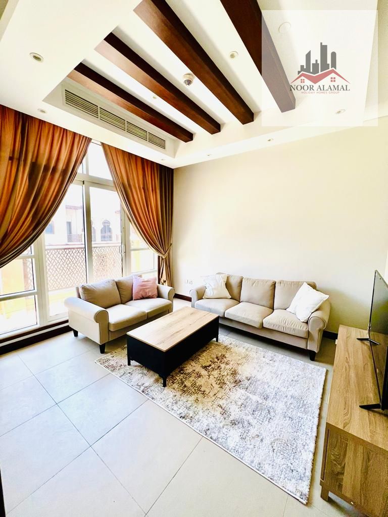 Sharjah - alriffa-alheera beach - one bedroom apartment with a living room, kitchen, and bathroom