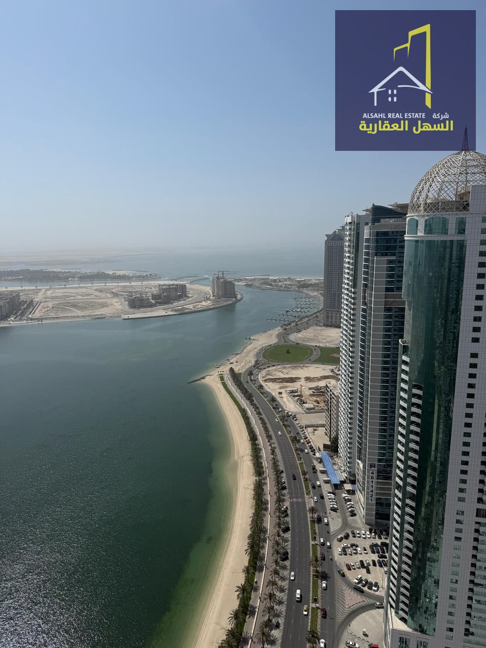 For sale, an apartment with a panoramic view of Al Khan Lake, in an excellent location