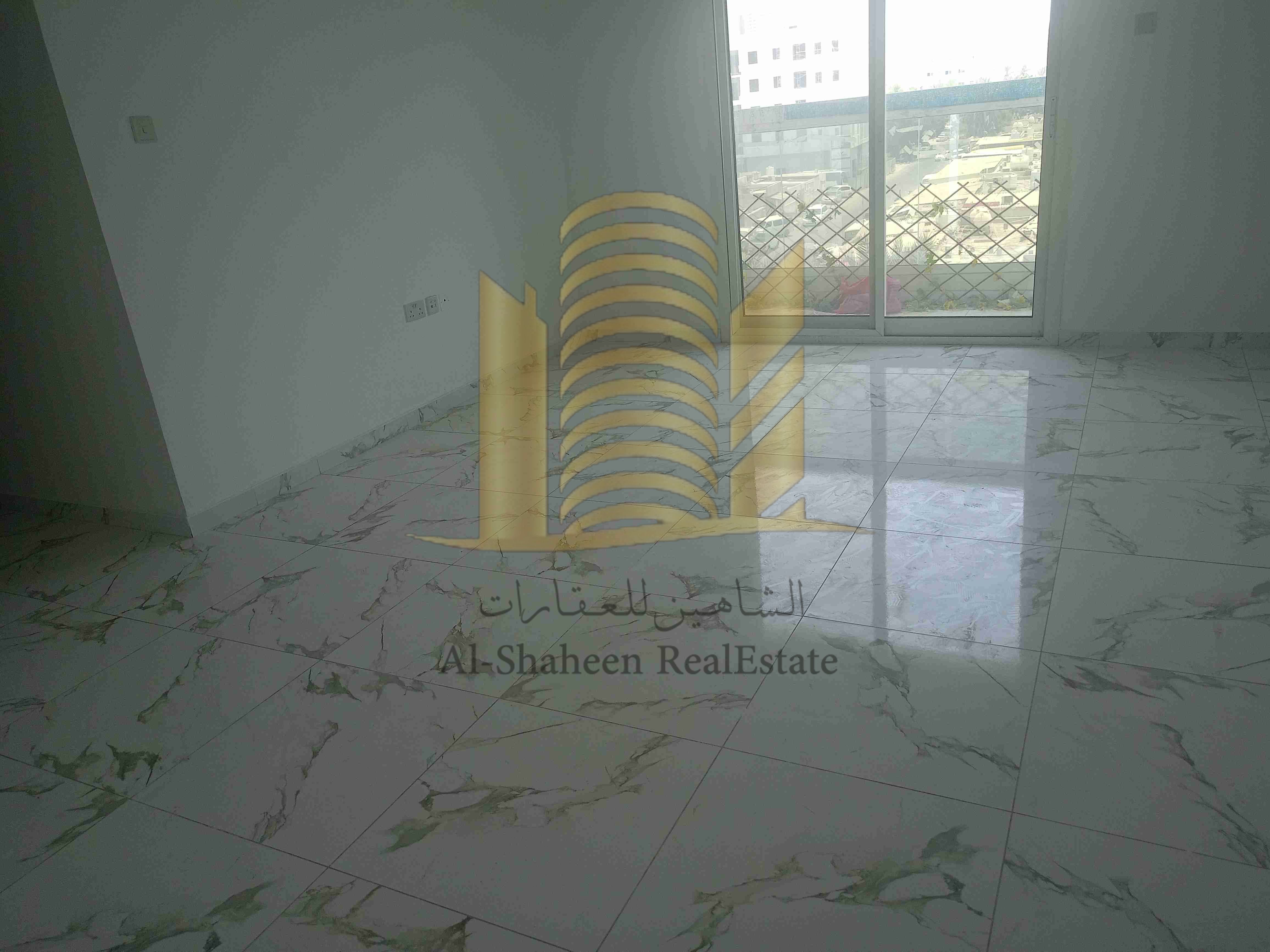 Two-bedroom apartment with a hall for annual rent in Al Rashidiya 2, next to the Ladies Park
