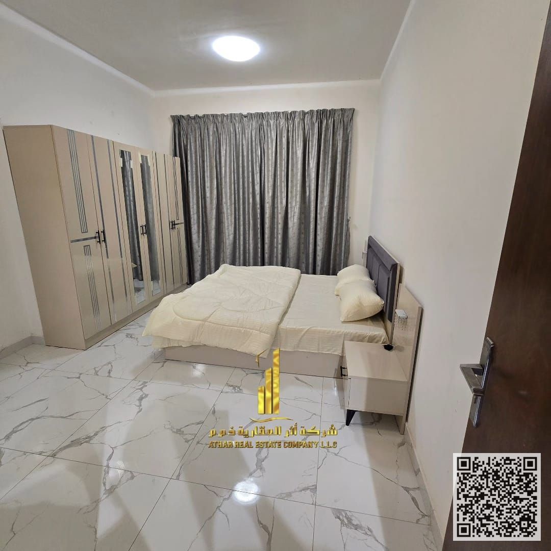 The most beautiful one-bedroom apartment with an open view, a gym, a swimming pool, and parking for rent in Ajman - Al Rashidiya 1 - Oasis Towers