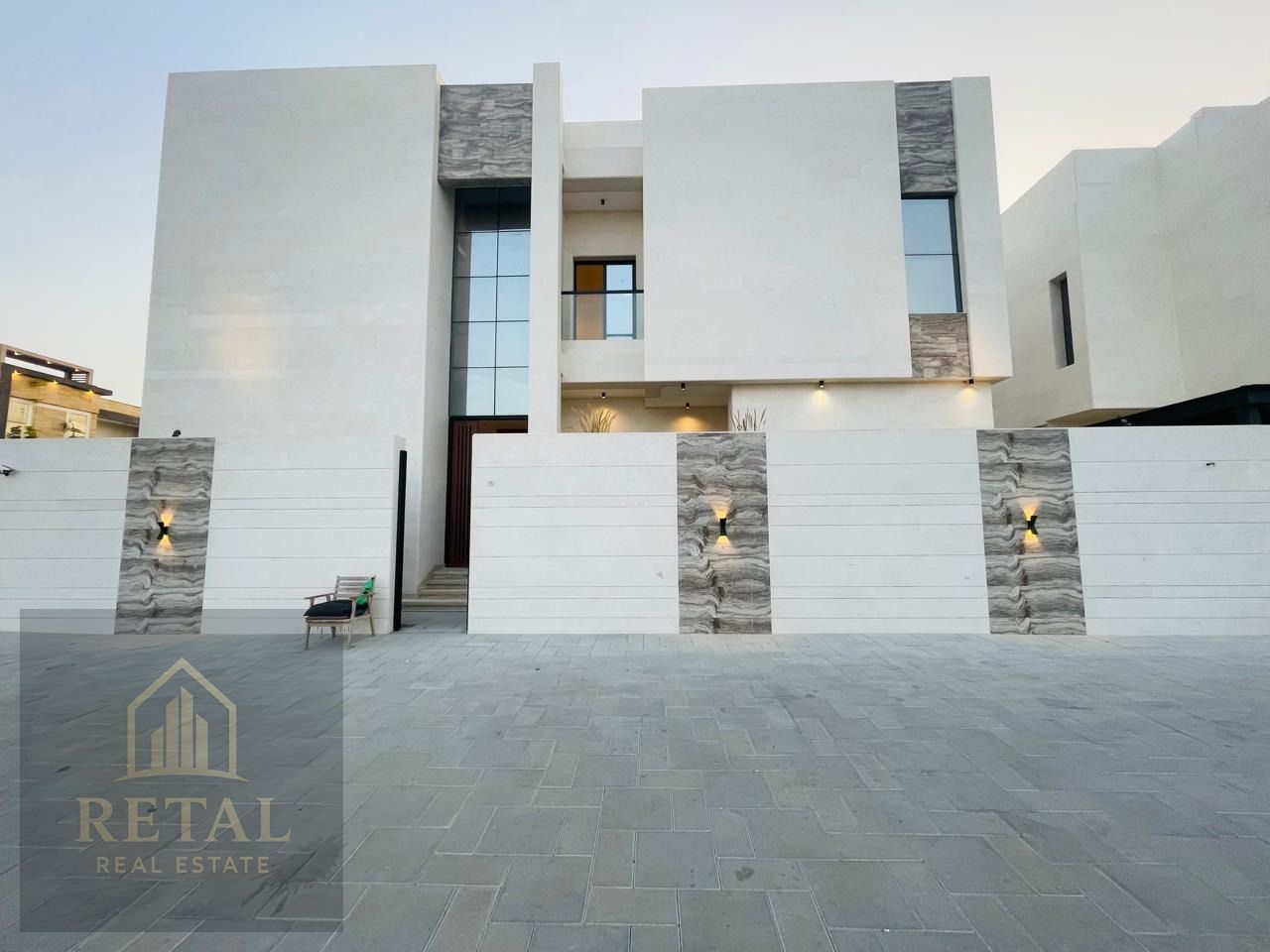 Independent luxury villa for sale in Al Yasmeen Ajman with 5 bedrooms, spacious living room, guest area, modern kitchen, and premium location near MBZ