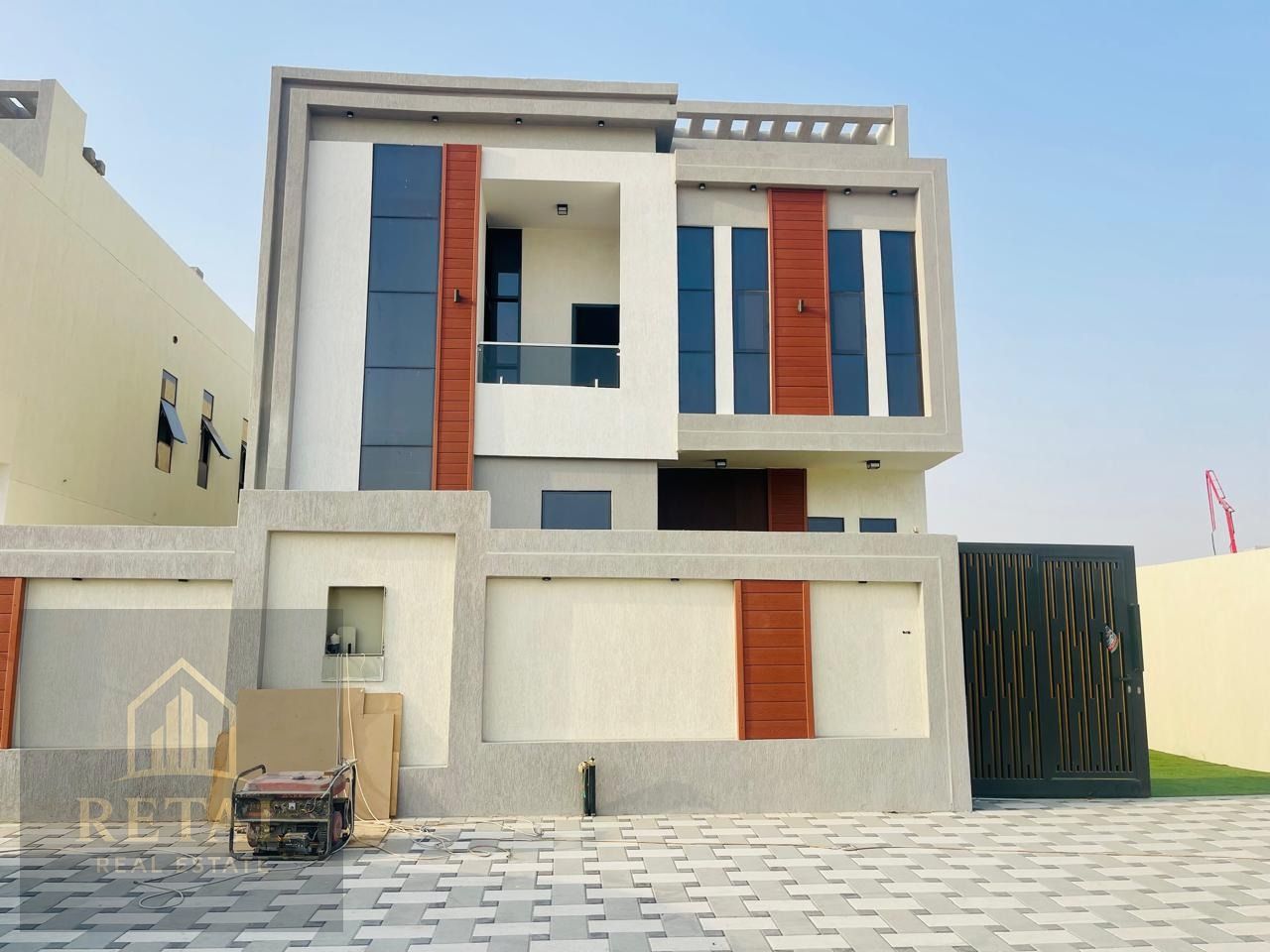 Modern and luxurious villa for sale in Al Helio 1, located in a prime area next to Emirati villa communities