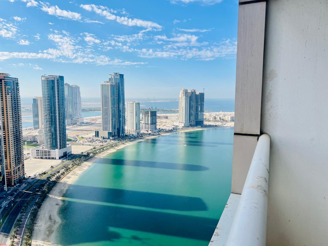 Partially sea view 1bhk with balcony storage gym&pool with parking in 49k only