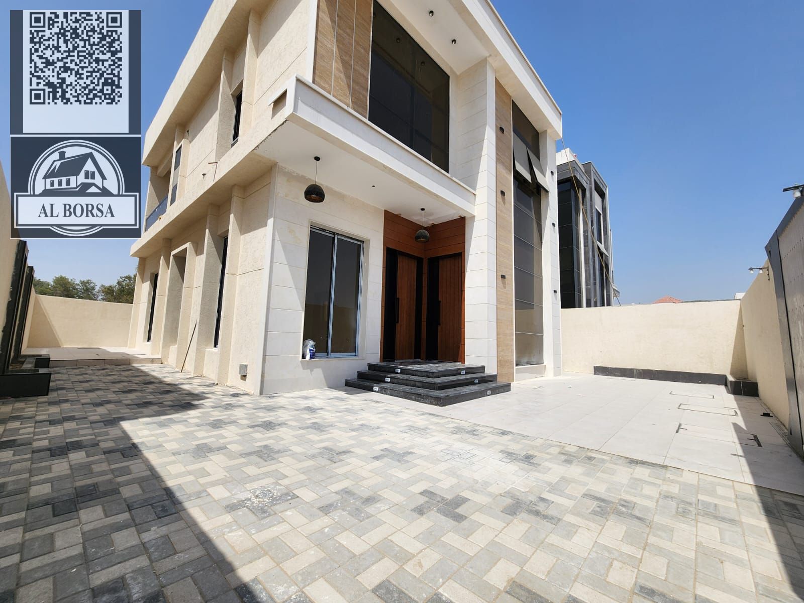 For sale, a villa in Al-Haliou, modern design, central air conditioning, 4 master bedrooms, a living room, and a large courtyard.