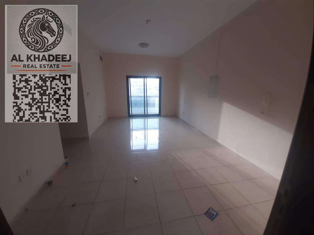Premium apartment for annual rent in Ajman Rashidiya 1, 2BR + hall with balcony and 3 baths, prime location next to Rawabi Market on Al Mina Street