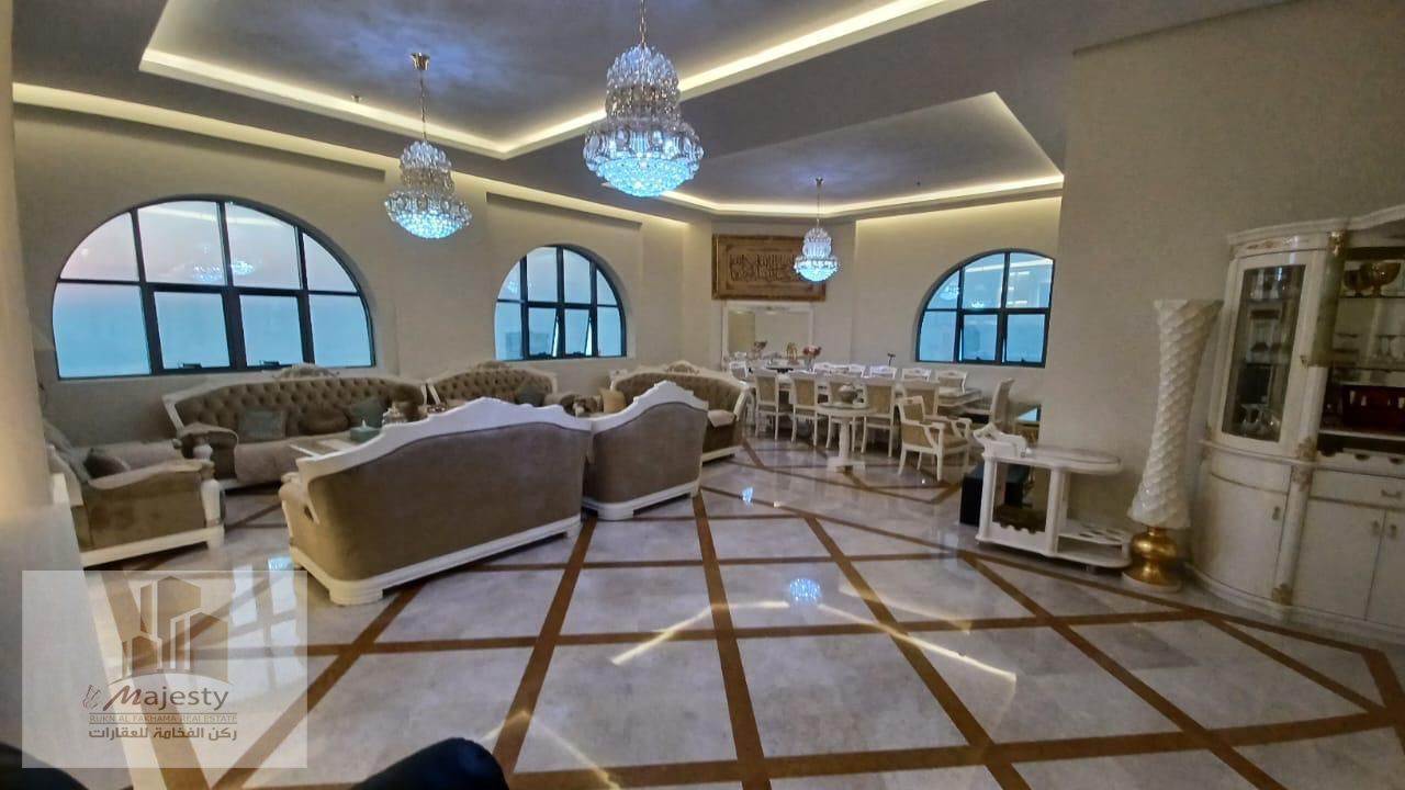 A fully furnished duplex apartment for sale with 4 master bedrooms over two floors, featuring a panoramic view of the Mamzar Sea.