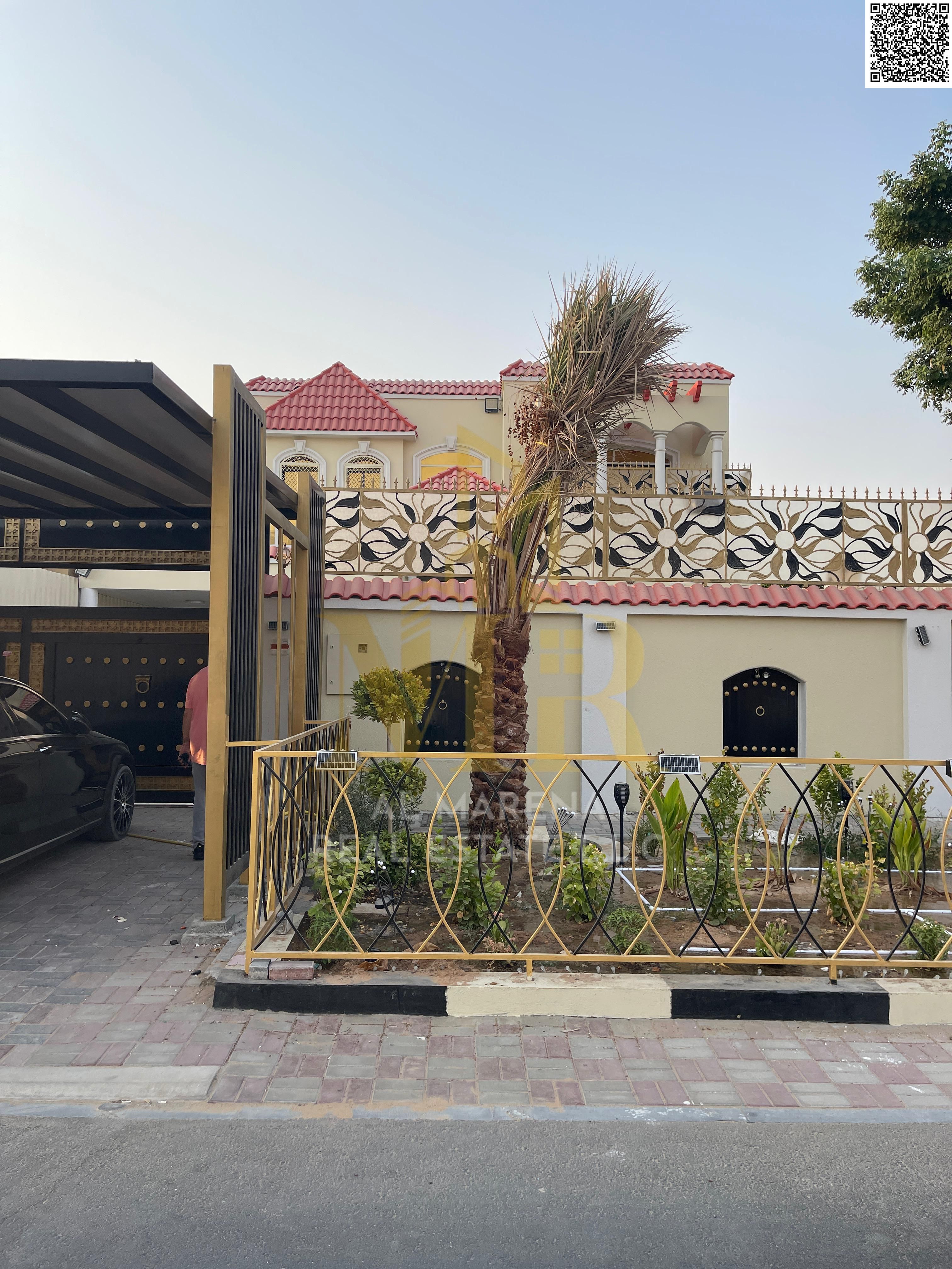 Furnished residential villa for sale on a street and alley in Al Rawda 2 area in Ajman, at a price including electricity, water, air conditioning and