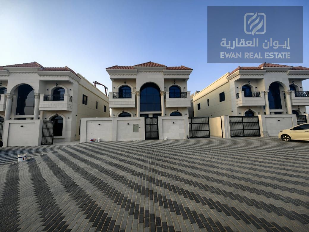 For Sale | Luxurious corner villa in Al Helio, Ajman, super deluxe finishing + private pool, prime location: - Near the exits from Sharjah and Dubai .