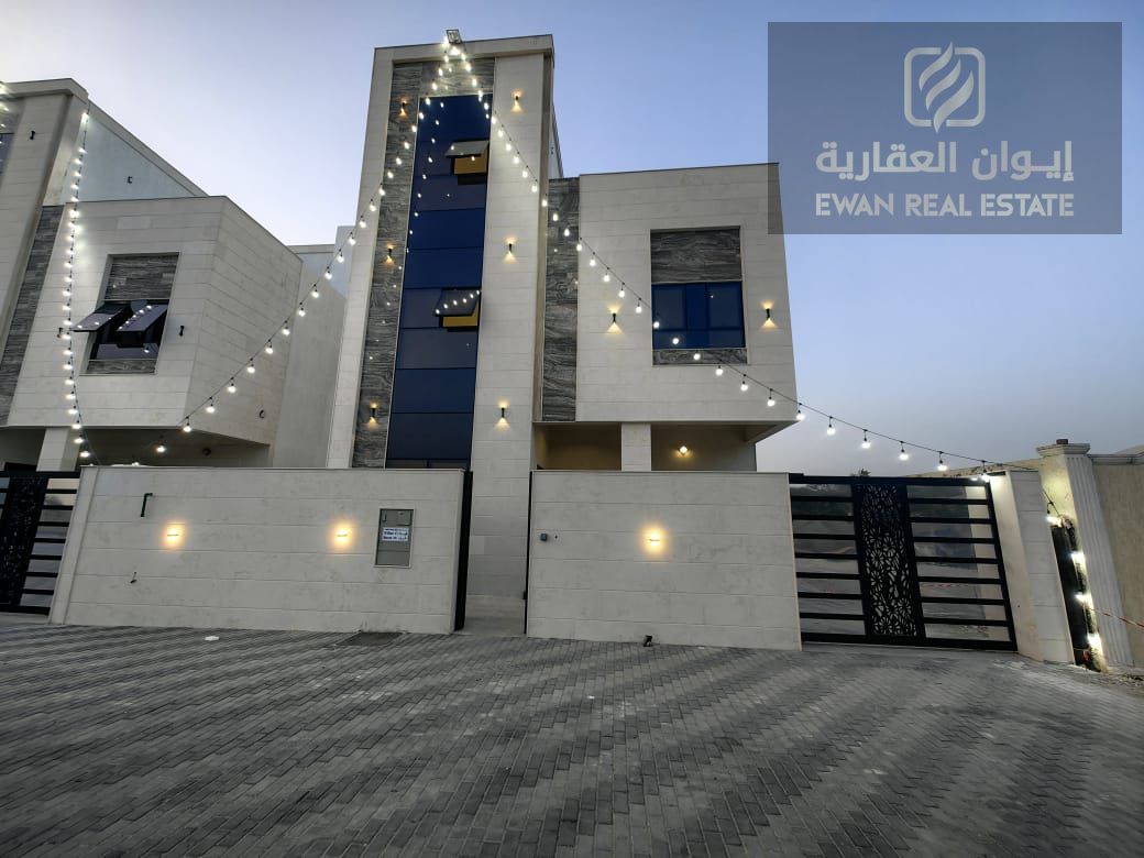 A luxurious super deluxe villa for sale in Al Helio 2, Ajman, at an attractive price, including registration and ownership fees.