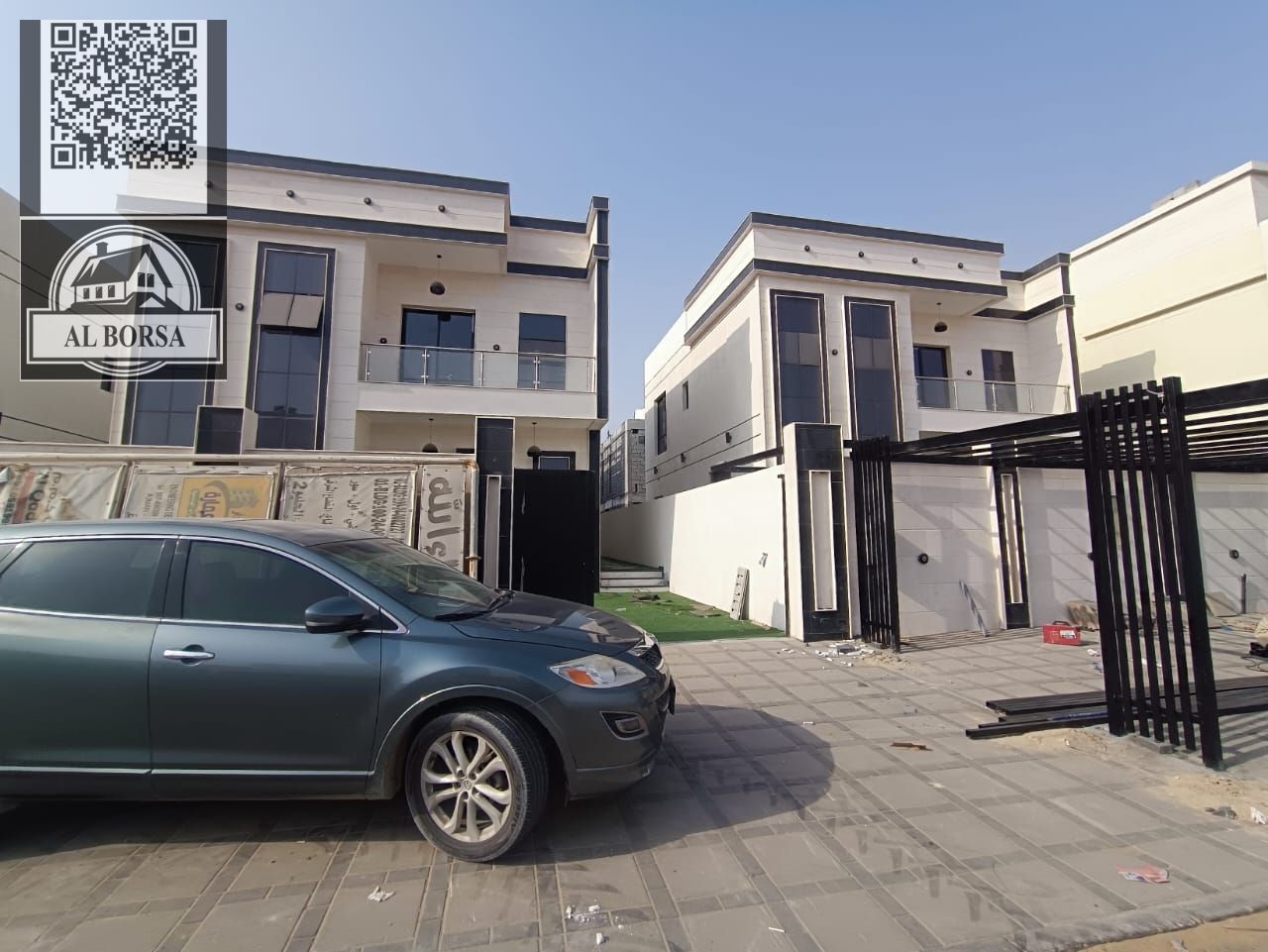 For sale, a villa in Al Helio 2, Ajman, consisting of 3 bedrooms, a hall, a majlis, and a maid’s room, including registration fees and central air con