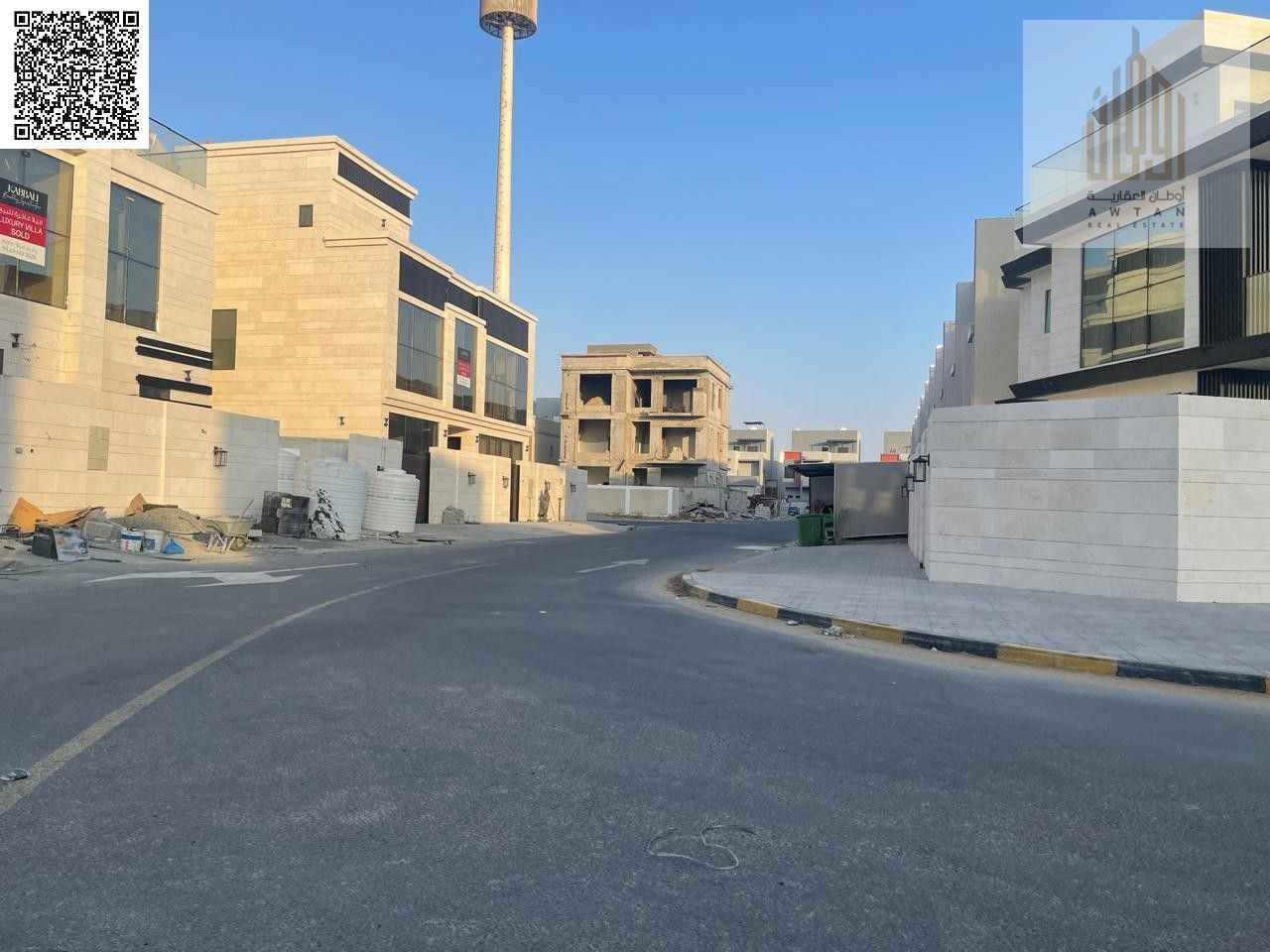 For sale: Residential-commercial land in Ajman Emirate, Al-Helio 2 area, directly on Al-Zubair Street, with both front and back streets. The plot cove