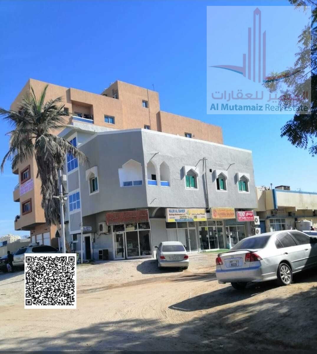 For sale, a residential and commercial building in the Al Bustan area, Liwara, a residential and commercial building, a very, very excellent location,