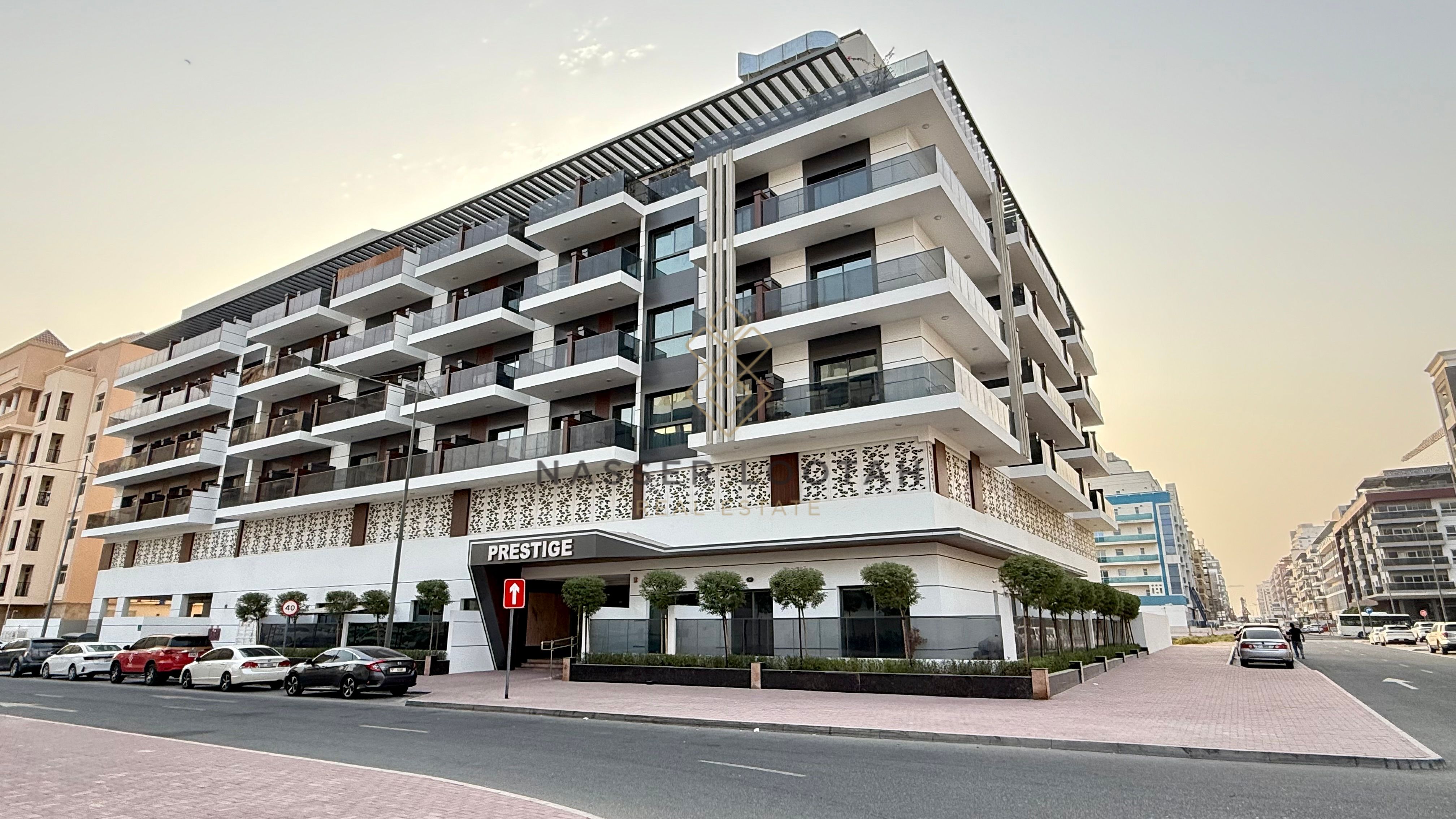 Modern 1BR | Balcony with Open View | Warsan 4