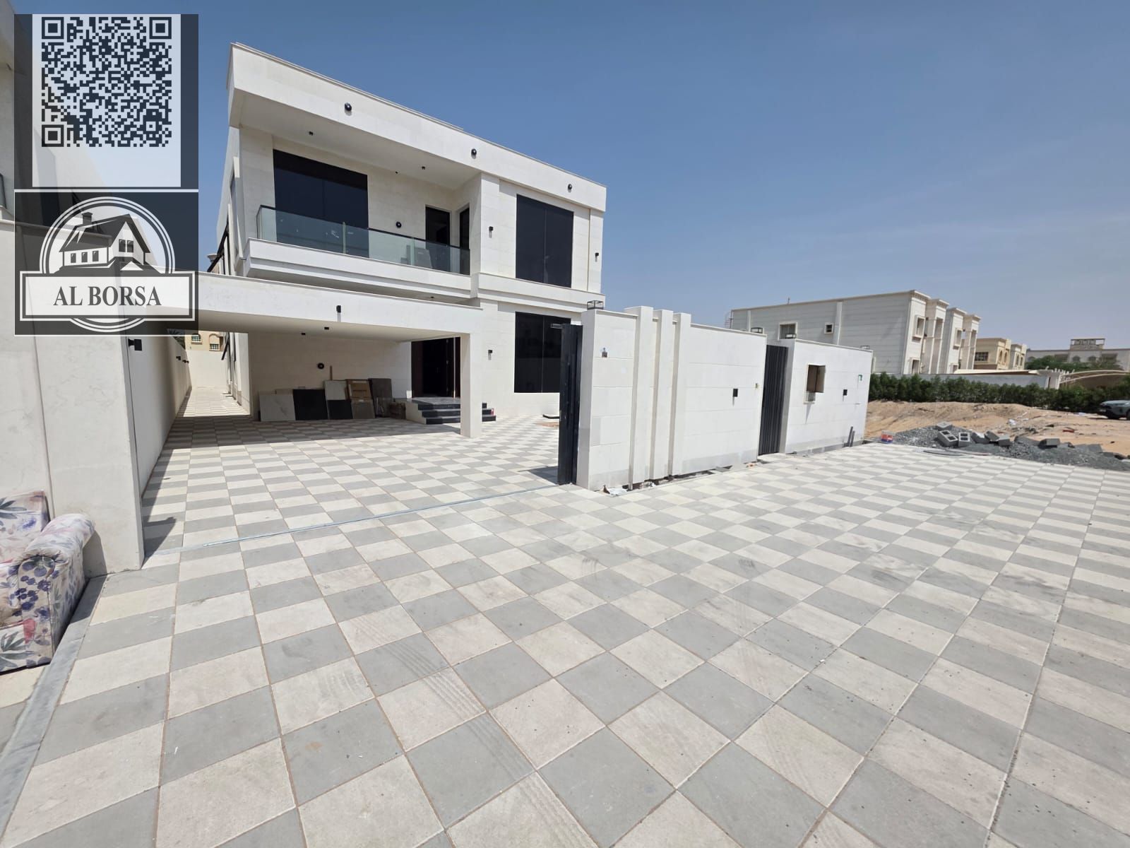 For sale, a villa in Al Rawda 2, Ajman, 5 bedrooms, a living room, two halls, a kitchen with a maid’s room, and a spacious yard.