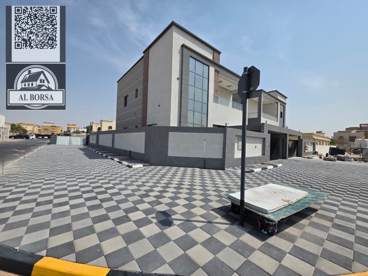 For sale, a villa in Al Rawda 2, Ajman, 5 bedrooms, a living room, two halls, a kitchen with a maid's room, a spacious courtyard, and central air cond