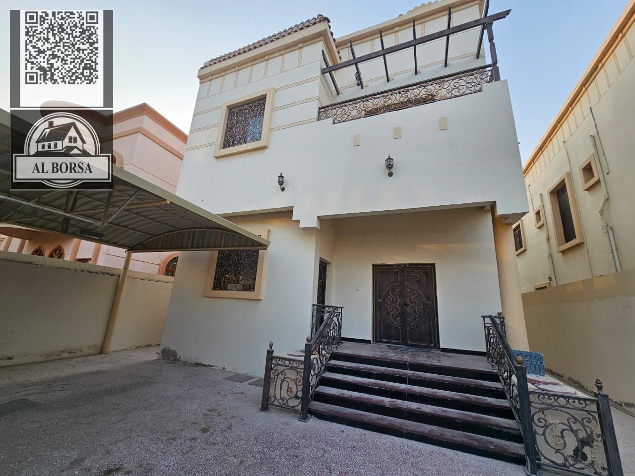 Villa for sale in Ajman, Al Muwaihat 3 area, consisting of two floors, a majlis, a hall, a kitchen, five master bedrooms, a maid's room, and a garage