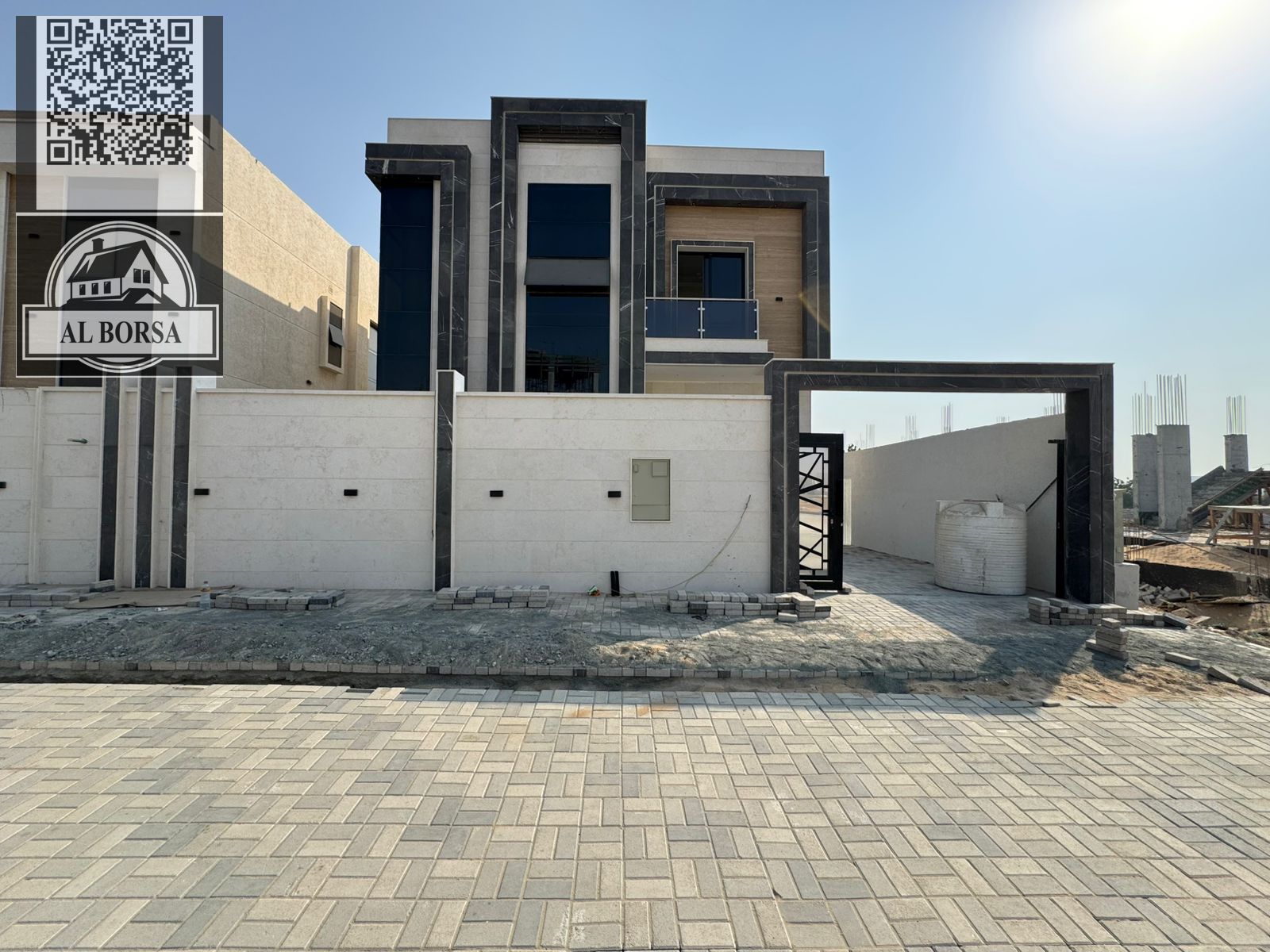 Villa for sale in Al Helio 2, directly opposite Al Zahya, five master bedrooms, a living room, a kitchen, and a maid