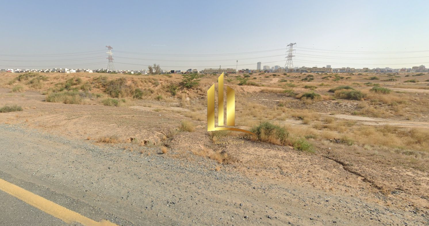 For sale, a distinctive commercial land in Al Dabdaba, north of Al Zubair Orchards - Sharjah - area 3435 square feet