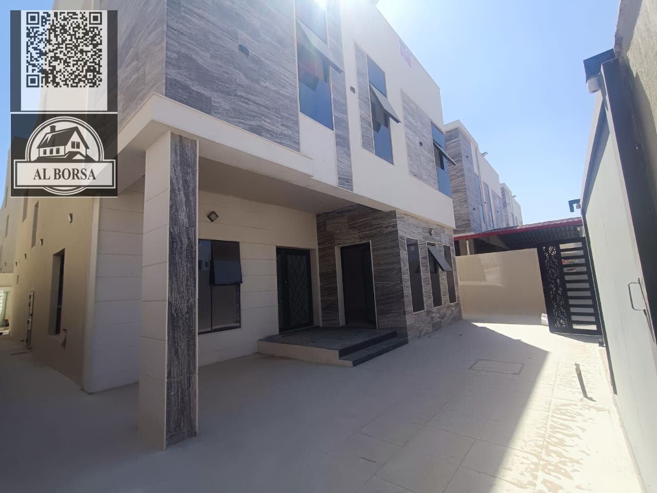 For rent a villa in Al Helio 2 in Ajman, 5 master bedrooms, a majlis, a hall, a maid's room, and a store with roof