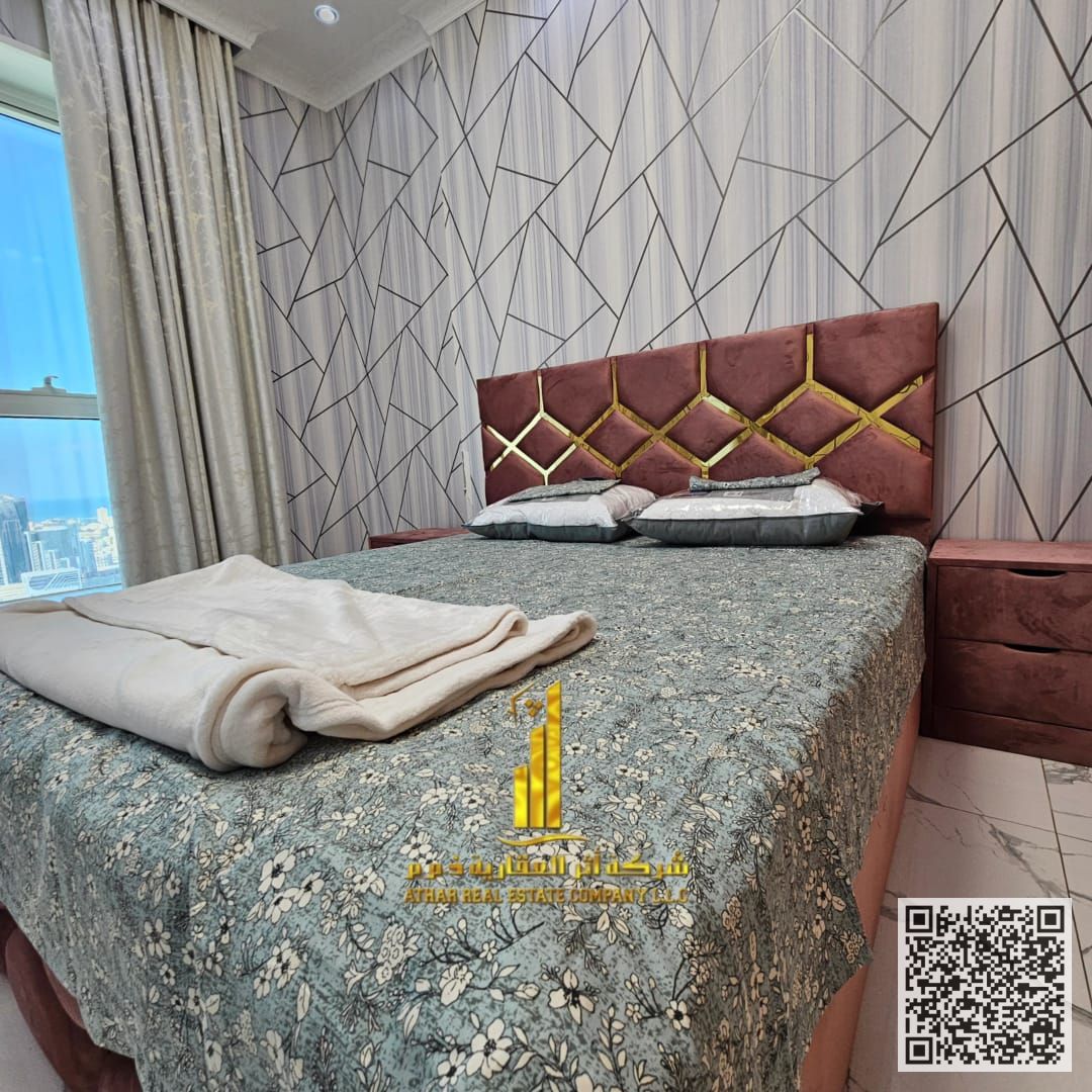 Luxurious two-bedroom apartment with a living room, open view, newly furnished, for monthly rent in Ajman - Al Rashidiya 1 - Oasis Towers