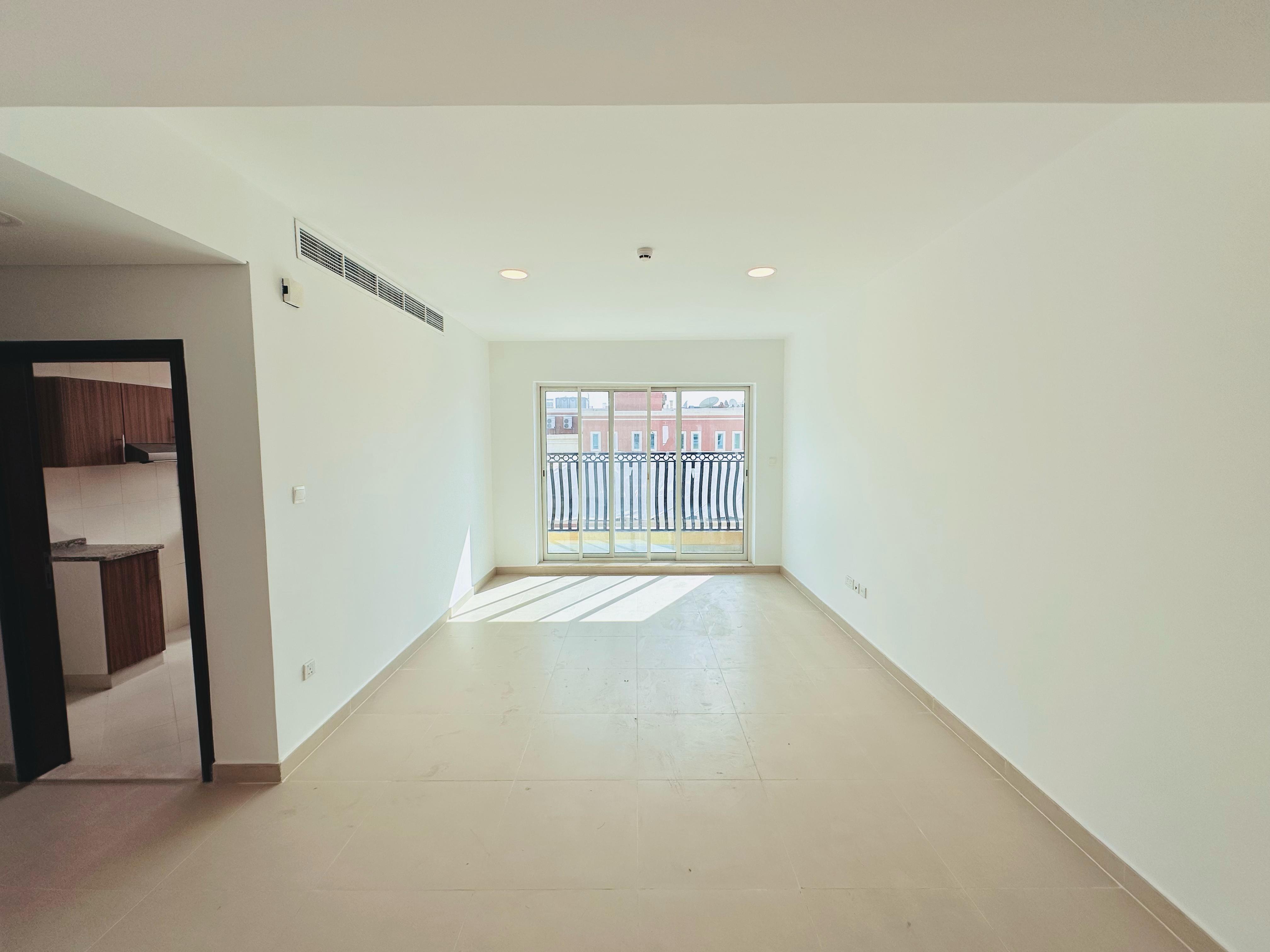 LIKE A NEW SPACIOUS 2 BEDROOM WITH CLOSED KITCHEN HAVING 2 BALCONIES AND PARKING .