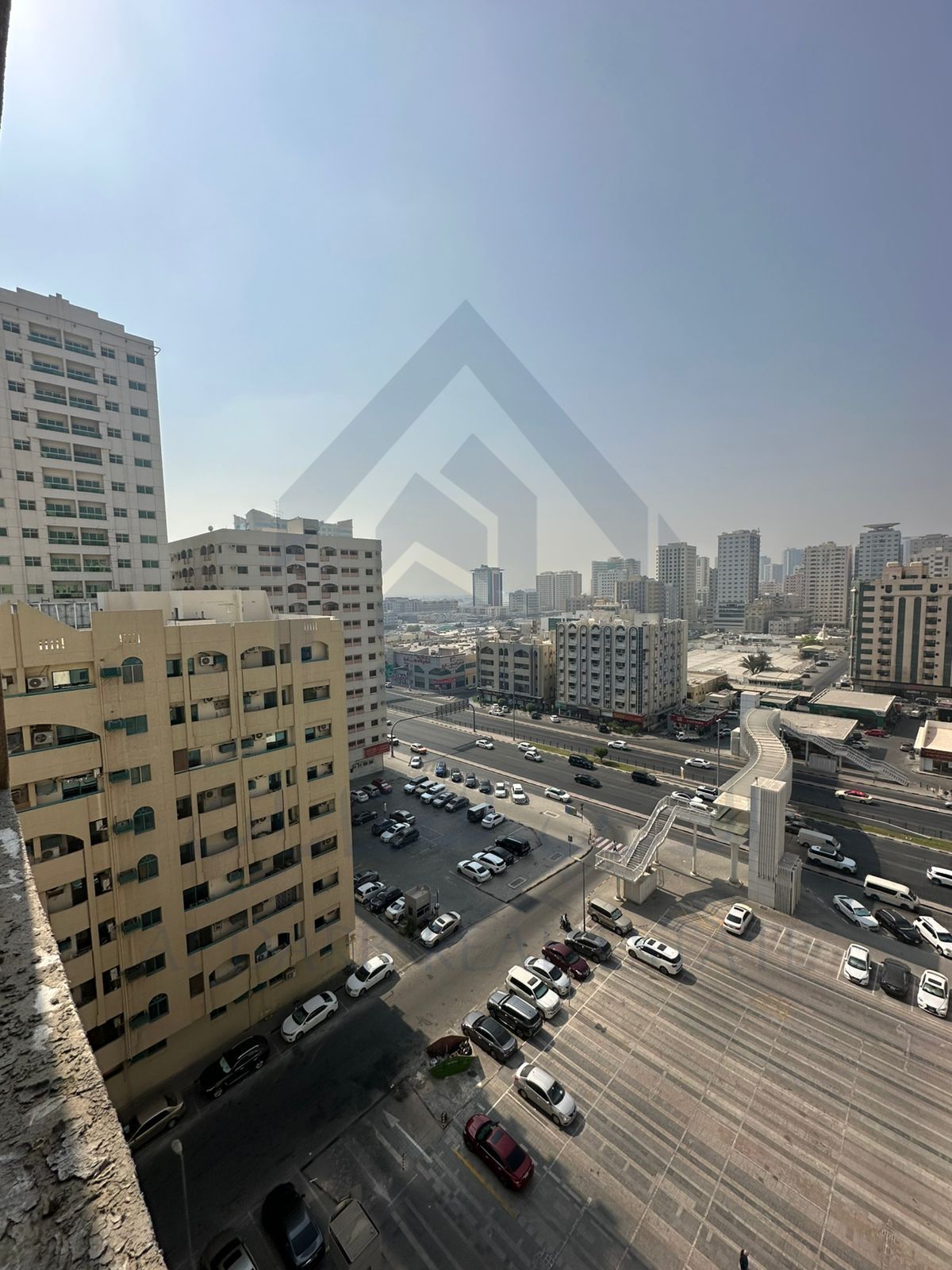 For sale, a two-bedroom apartment with a hall next to Mega Mall in the Emirate of Sharjah, freehold for all nationalities