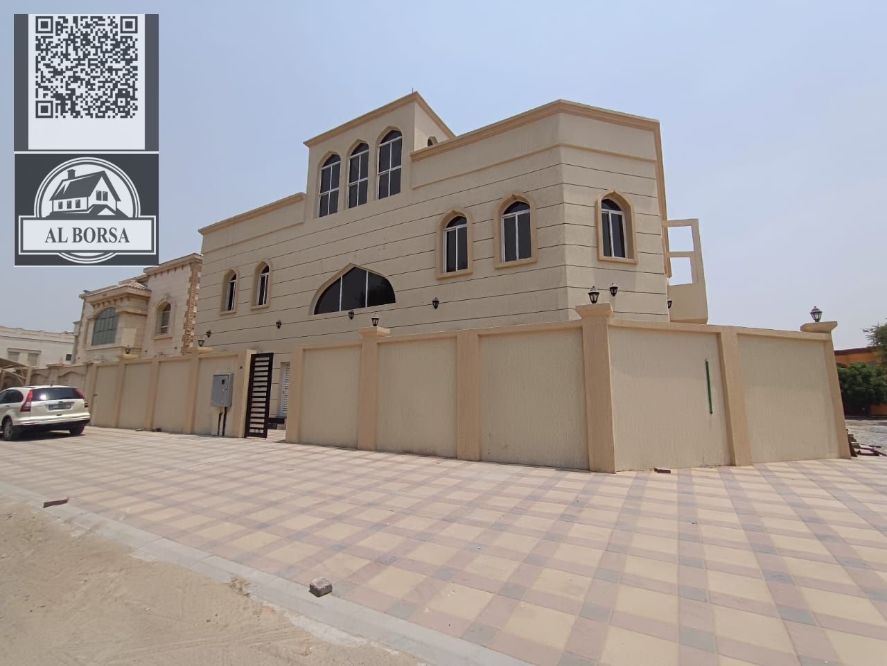 Villa in Al Mowaihat 3, residential and investment, for sale: 12 bedrooms, 4 living rooms, 4 kitchens, and a spacious reception hall. Land area: 7,000