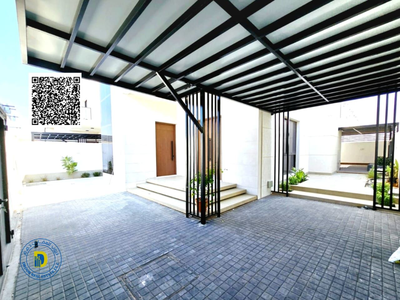 For sale, a modern villa with 5 rooms and an outdoor seating area in Al Zahya area.