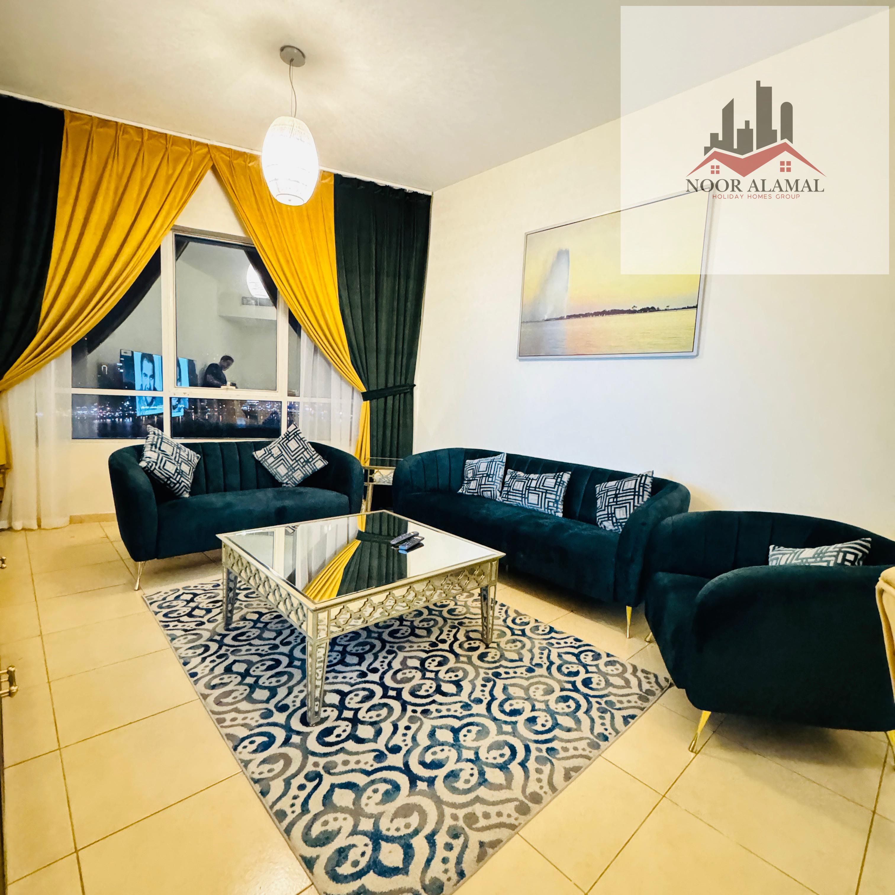Sharjah Al Khan, fully furnished apartment with hotel furniture, three rooms, a hall, a kitchen, three bathrooms, a balcony with an open view of the l